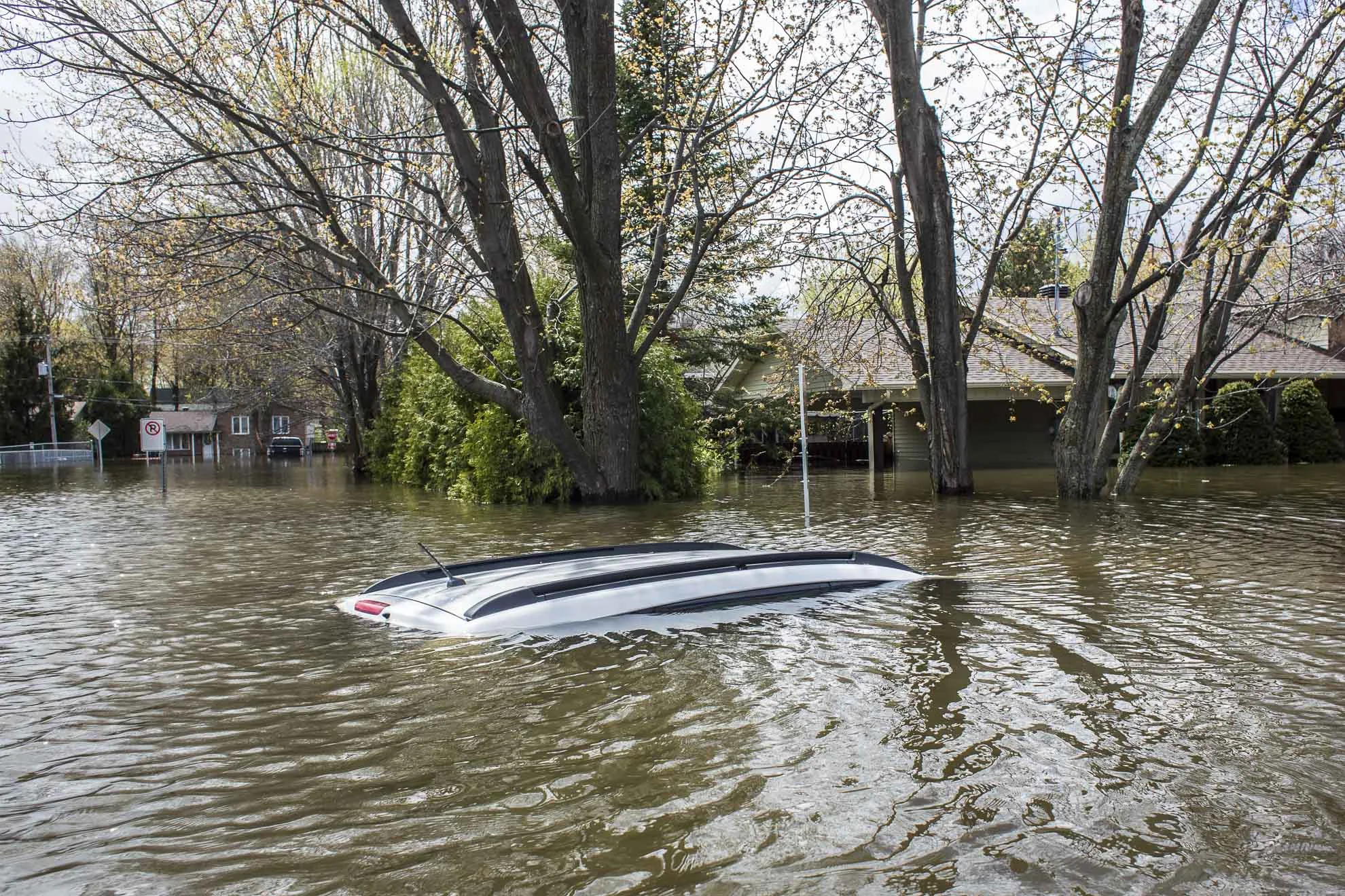  May 09, 2017 - Deux-Montagnes, Quebec, Canada: A car is completly flooded in a neighbourhood of Deux-Montagnes, (Normand Blouin/Polaris) 