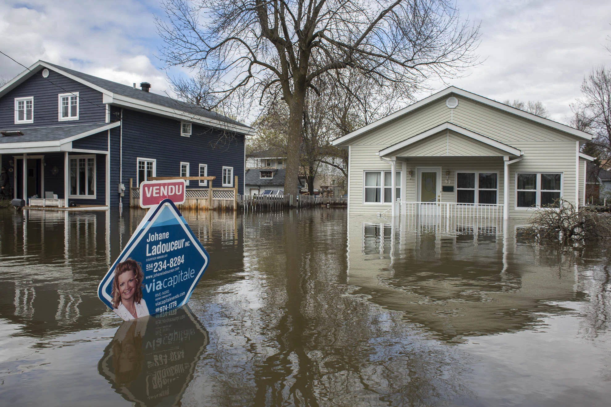  May 09, 2017 - Deux-Montagnes, Quebec, Canada: A sign shows a recent sale prior to the flooding. (Normand Blouin/Polaris) 