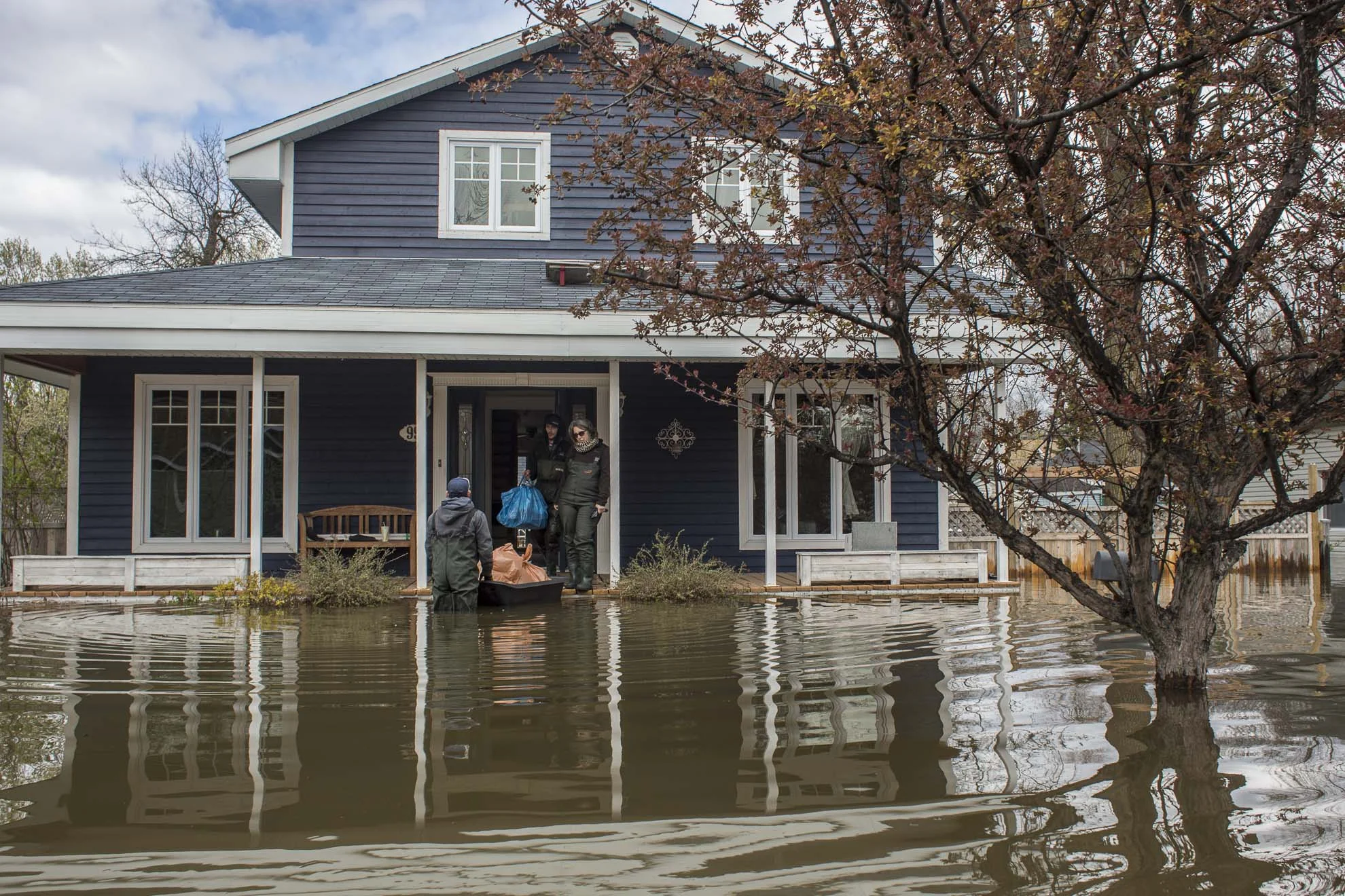  May 09, 2017 - Deux-Montagnes, Quebec, Canada: Residents get ready to leave their flooded hose. (Normand Blouin/Polaris) 
