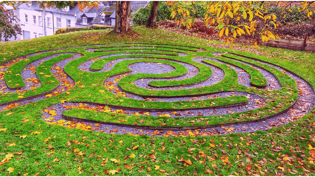 A labyrinth in the fall with leaves on the ground