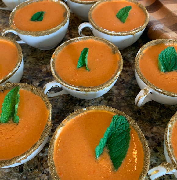 HEIRLOOM GAZPACHO - Organic Heirloom Tomatoes & English Cucumbers with bell peppers, sherry vinegar and garlic served in a teacup with a lemon & cumin dusted rim. *Vegan if served without crab, shrimp or other shellfish.