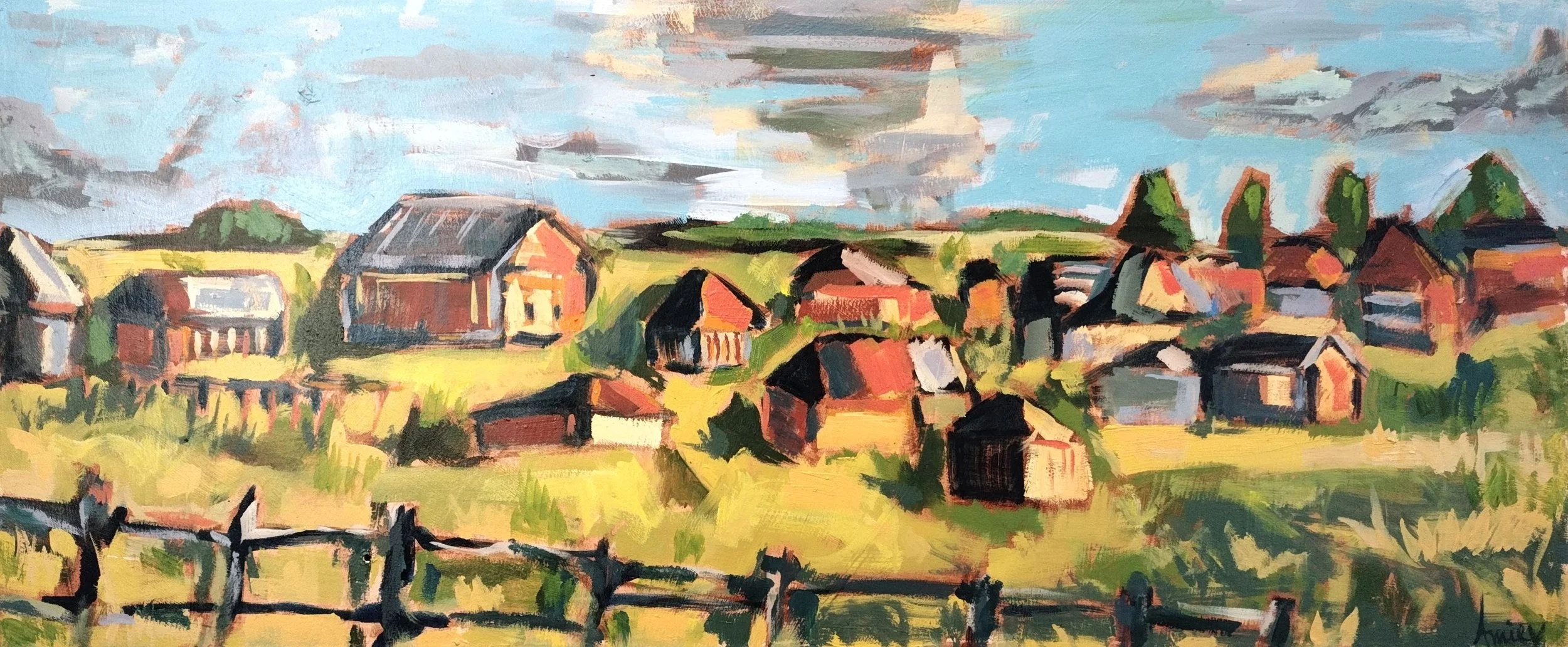 Field of slightly dilapidated houses and barns being rebuilt.