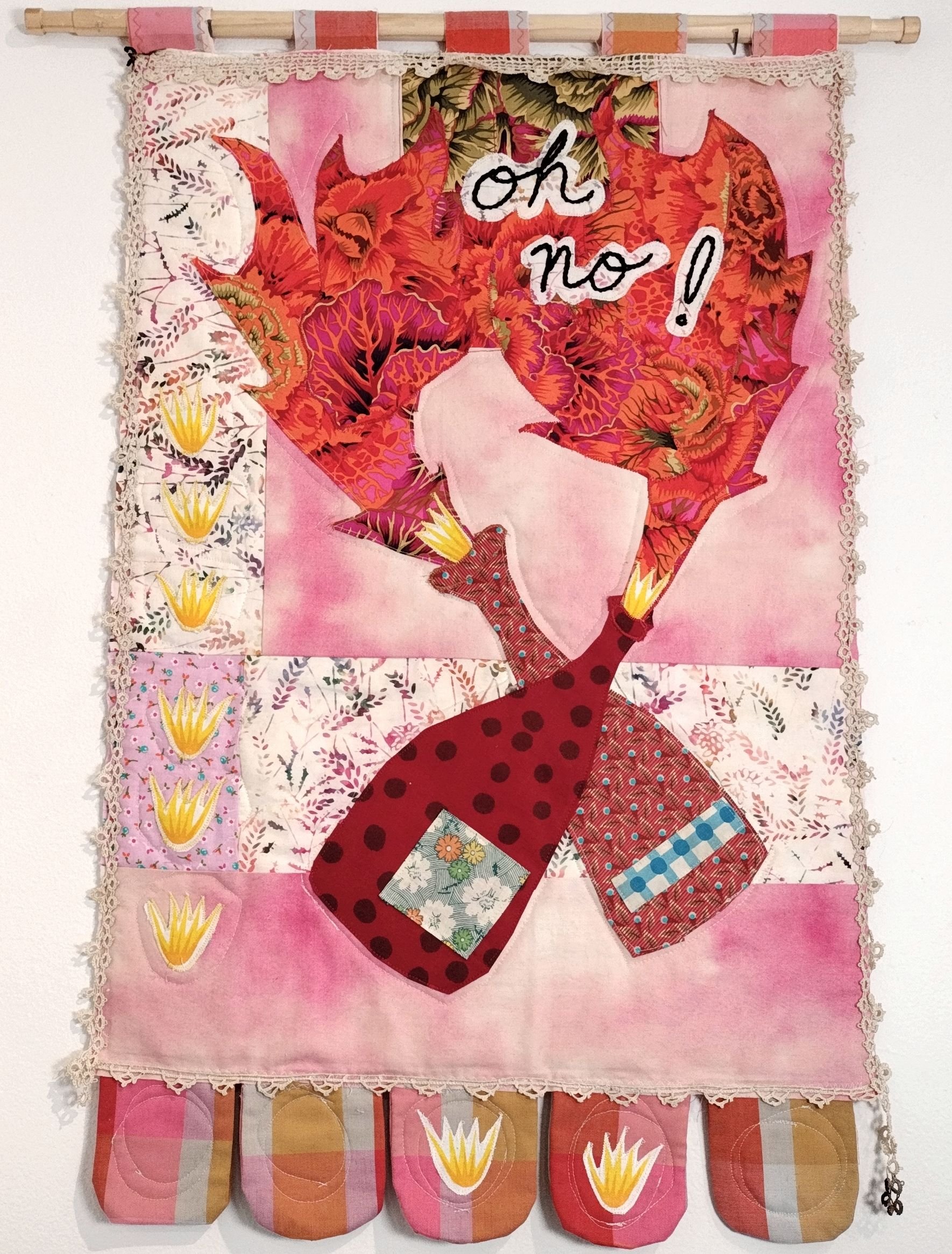 Quilted tapestry with potions flaming out of bottles, spelling the words "Oh no!"