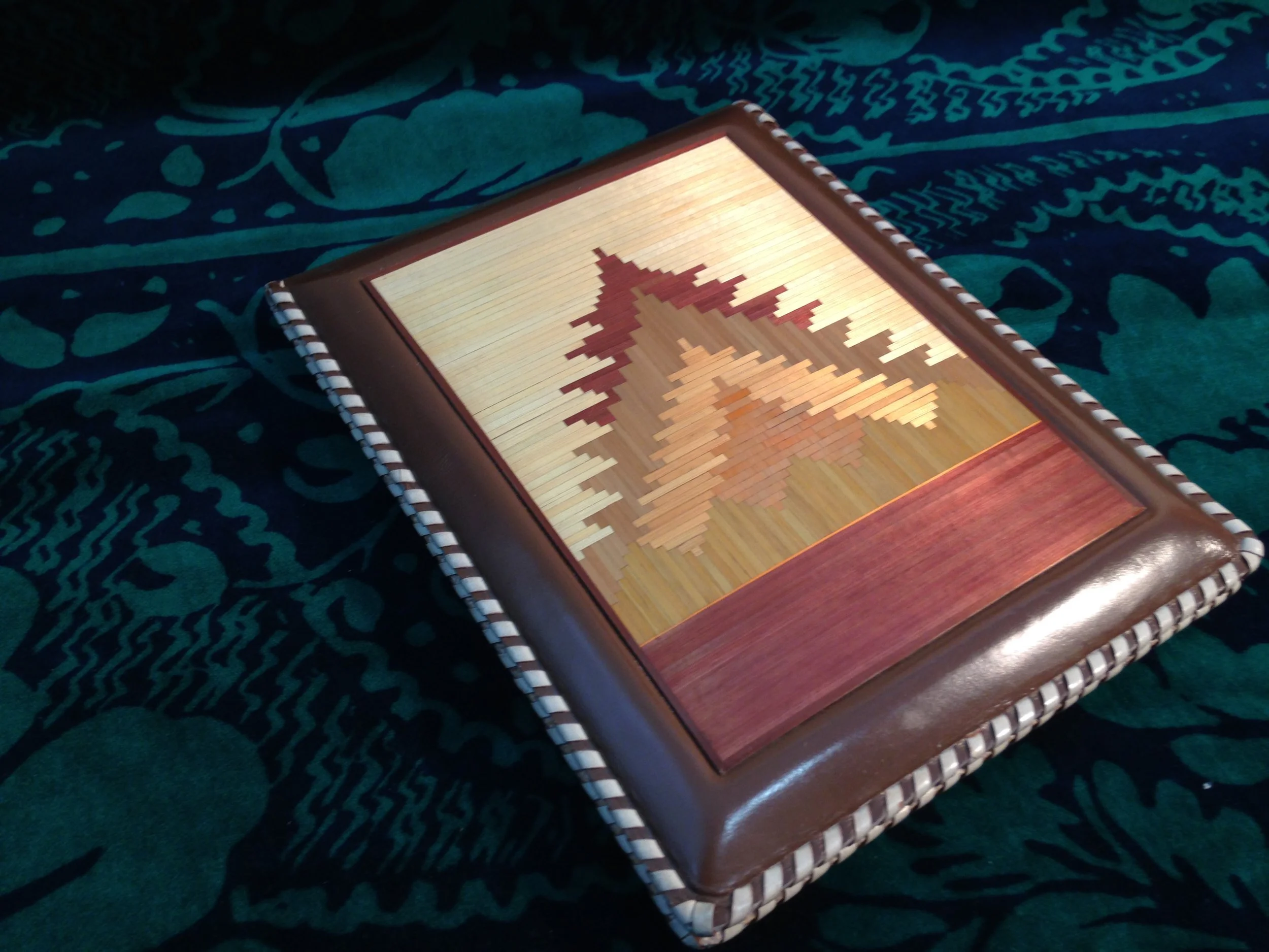 Handcrafted leather and straw notepad from Latvia.