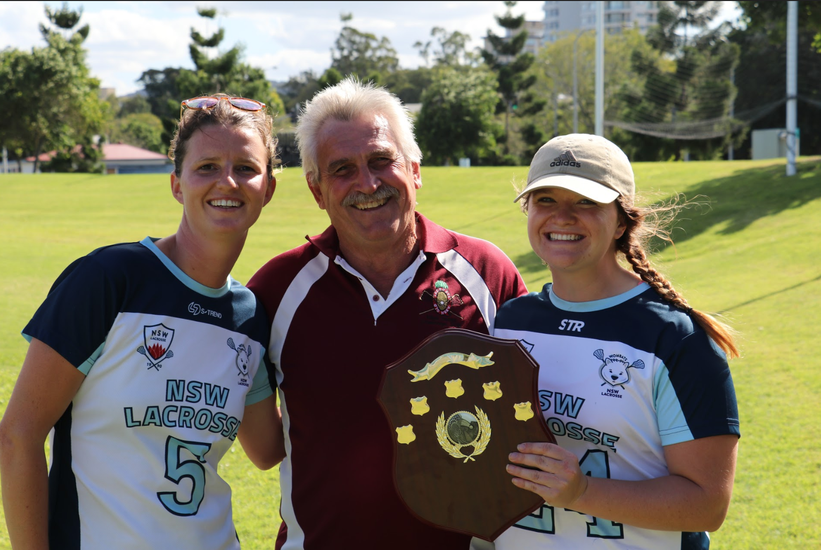 Captains Melie Pemberton and Savannah Duncan with the shield.