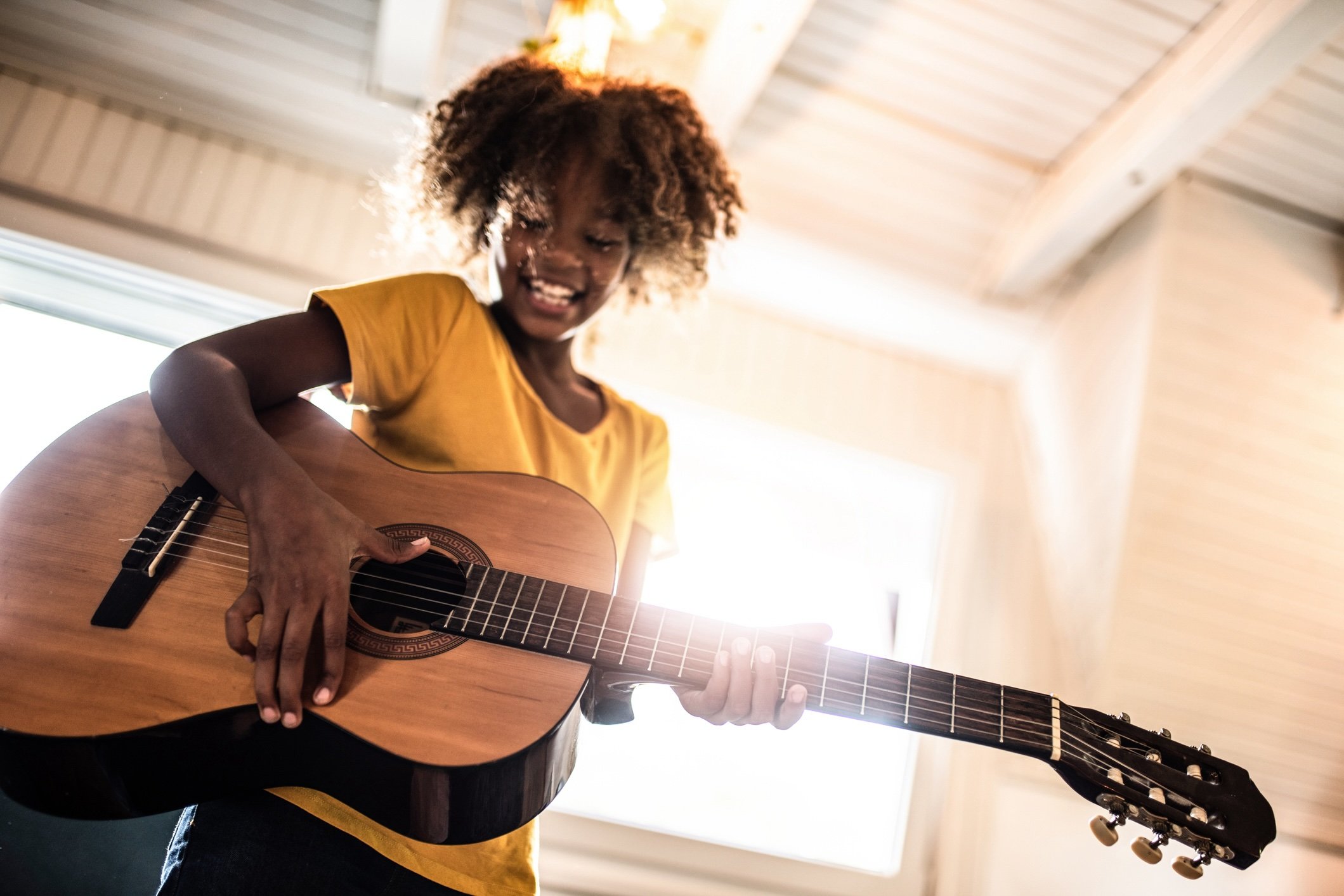 Child taking an acoustic guitar lesson at Collingswood Music