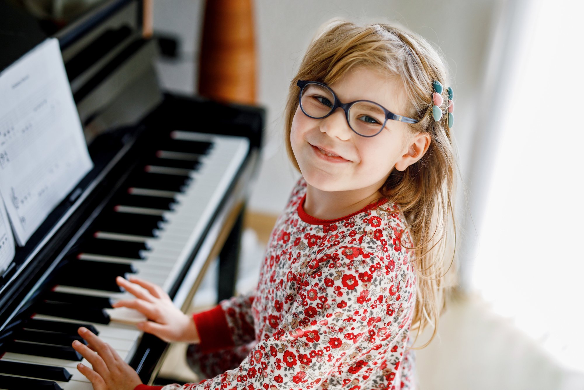Young pianist smiling during an in-store music event
