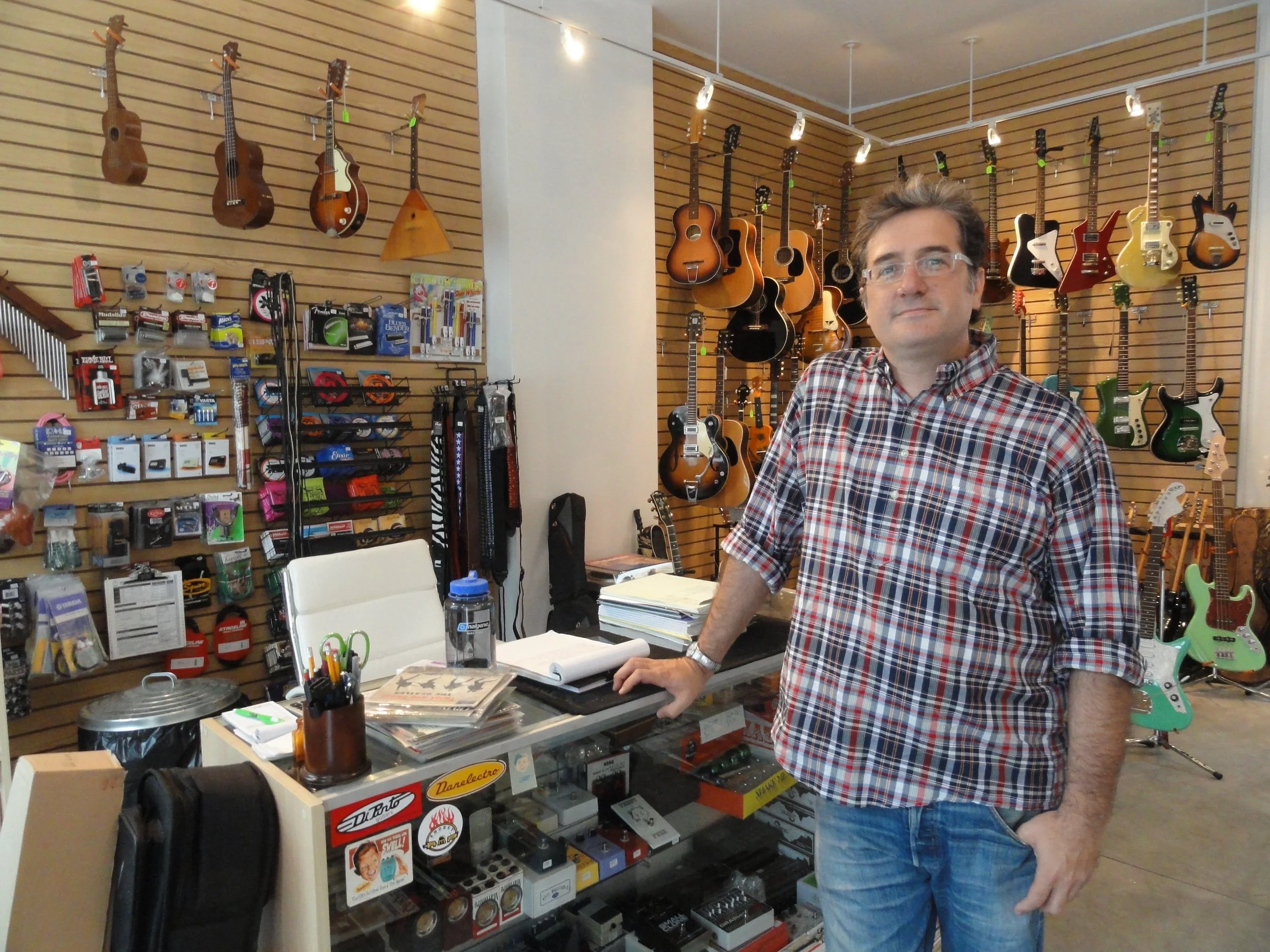 Inside Collingswood Music with a repair tech waiting for your repairs at the front counter