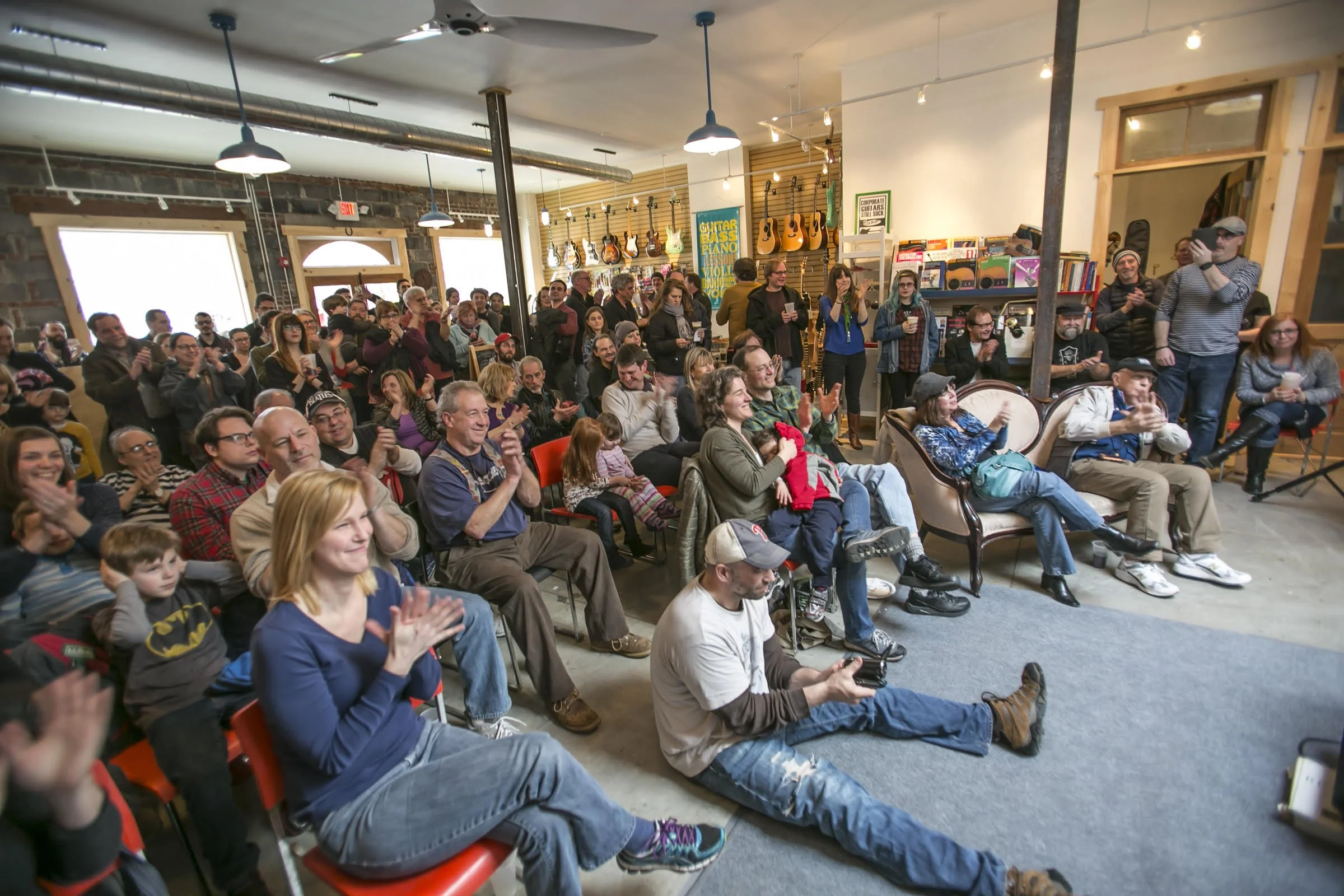 Audience enjoying a live music performance inside Collingswood Music