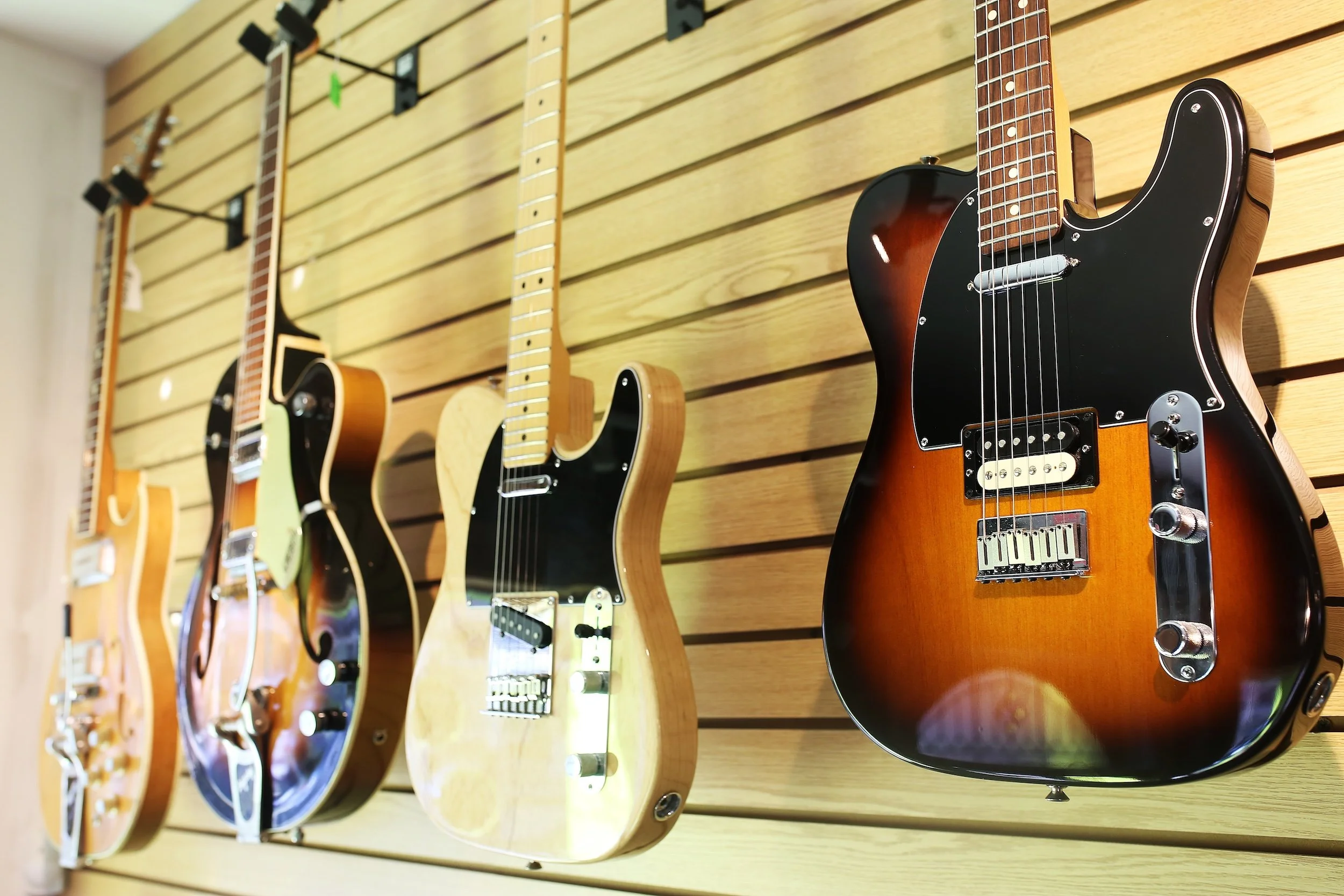 Electric guitars on display inside Collingswood Music instrument showroom