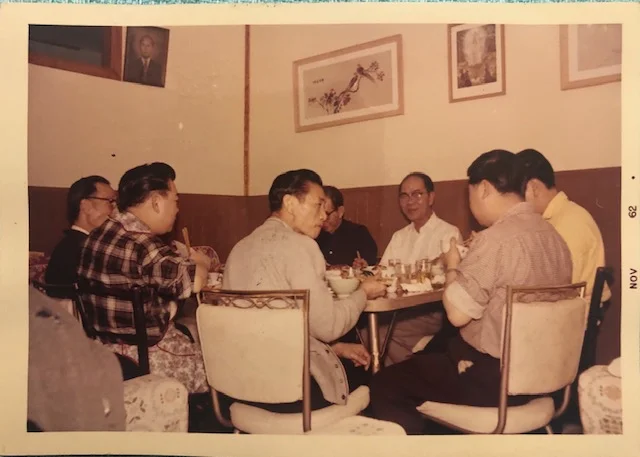 Men’s table a birthday party with Cynthia’s uncles, dad, and paper brothers; courtesy of the author