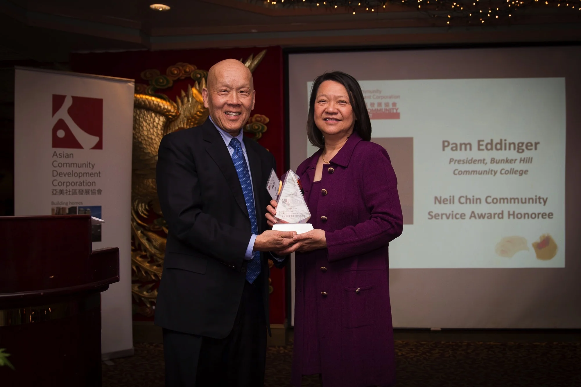 Paul presenting ACDC’s Neil Chin Community Service Award to Pam Eddinger, community advocate and President of Bunker Hill Community College (who is also a Barnard alum!) Photo by Black Dog Pictures