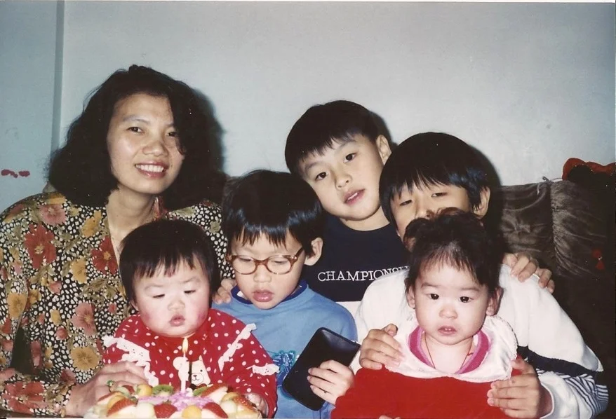 Erica on the bottom right with her cousins in their Dorchester home; photo courtesy of author