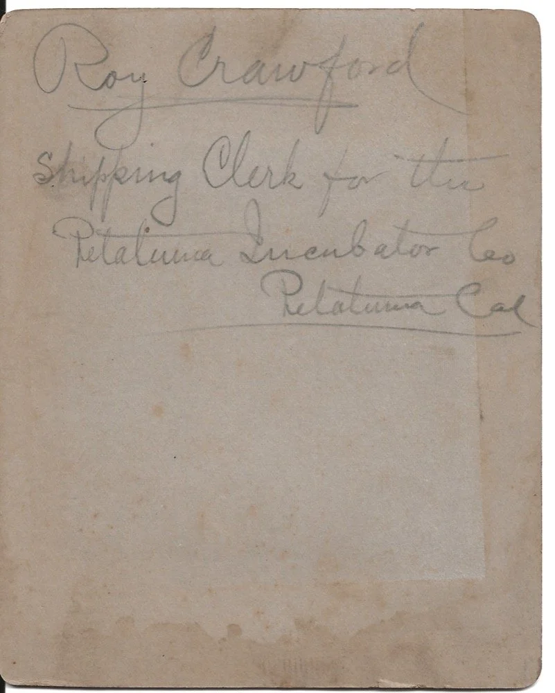The back of a photograph with writing on it.