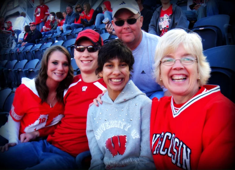 IN THE HUDDLE: (left to right) Lindsay, Max, Ani, Mike and Peg Grafwallner enjoy a day rooting for the Badgers.