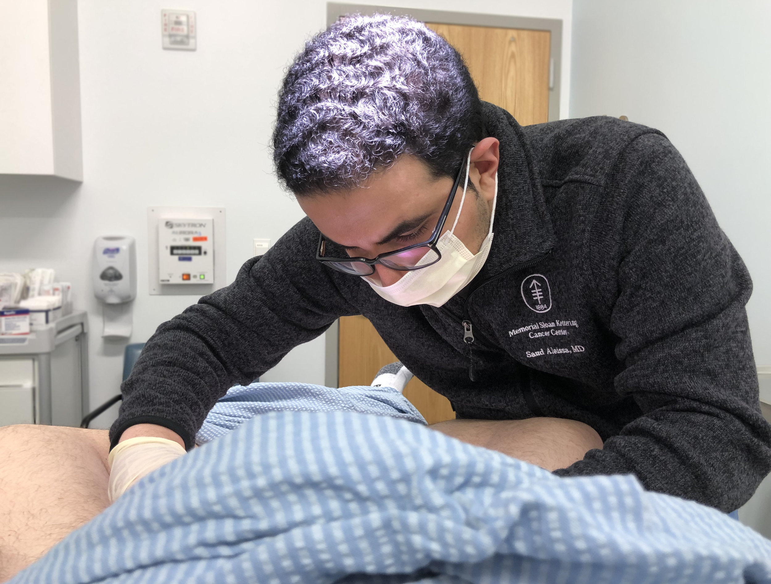 Dr. Saud Aleissa, at Memorial Sloan Kettering Cancer Center in New York, removes a biopsy sample from an EMPD patient. The procedure is commonplace in EMPD diagnosis and treatment.