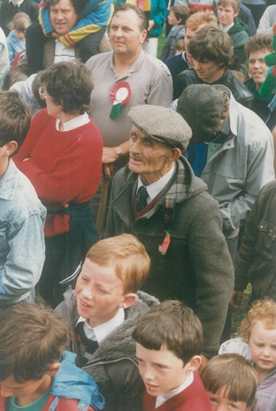 Cashel King Cormac’s club president, Willie Ryan (T), (the man with the cap), watching proceedings during the presentation of the cup at Cappawhite.