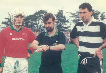 M. Quinn (Referee) about to throw in the ball before the Munster Club final at Mitchelstown, December 1991. Cashel King Cormac’s captain, Colm Bonnar, and Midleton captain, Ger Fitzgerald.