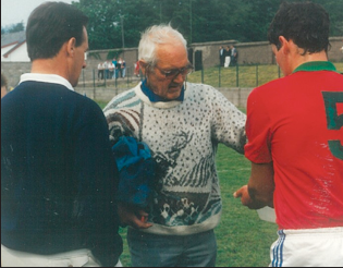 Cashel King Cormac’s first aid man, Pearse Bonnar, dispensing aid to son, Conal, with Justin McCarthy looking on.