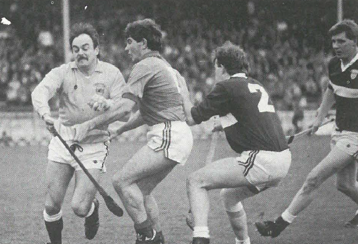 Borrisoleigh goal keeper Noelie Maher clears despite close attention of Seamus Bohane of Loughmore Castleiney