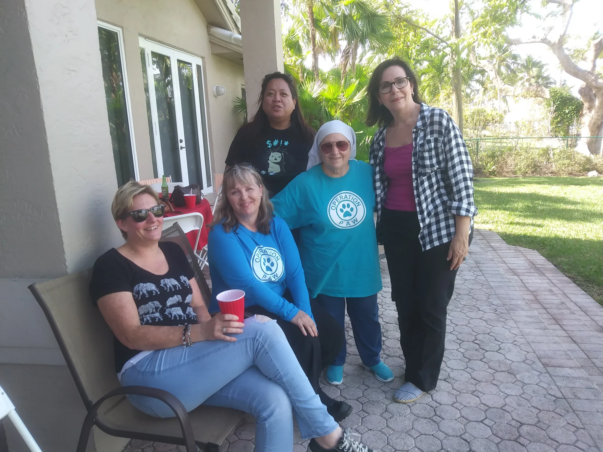 The "Cat Crew". Board member Ana Sanchez with members of Operation Paw.