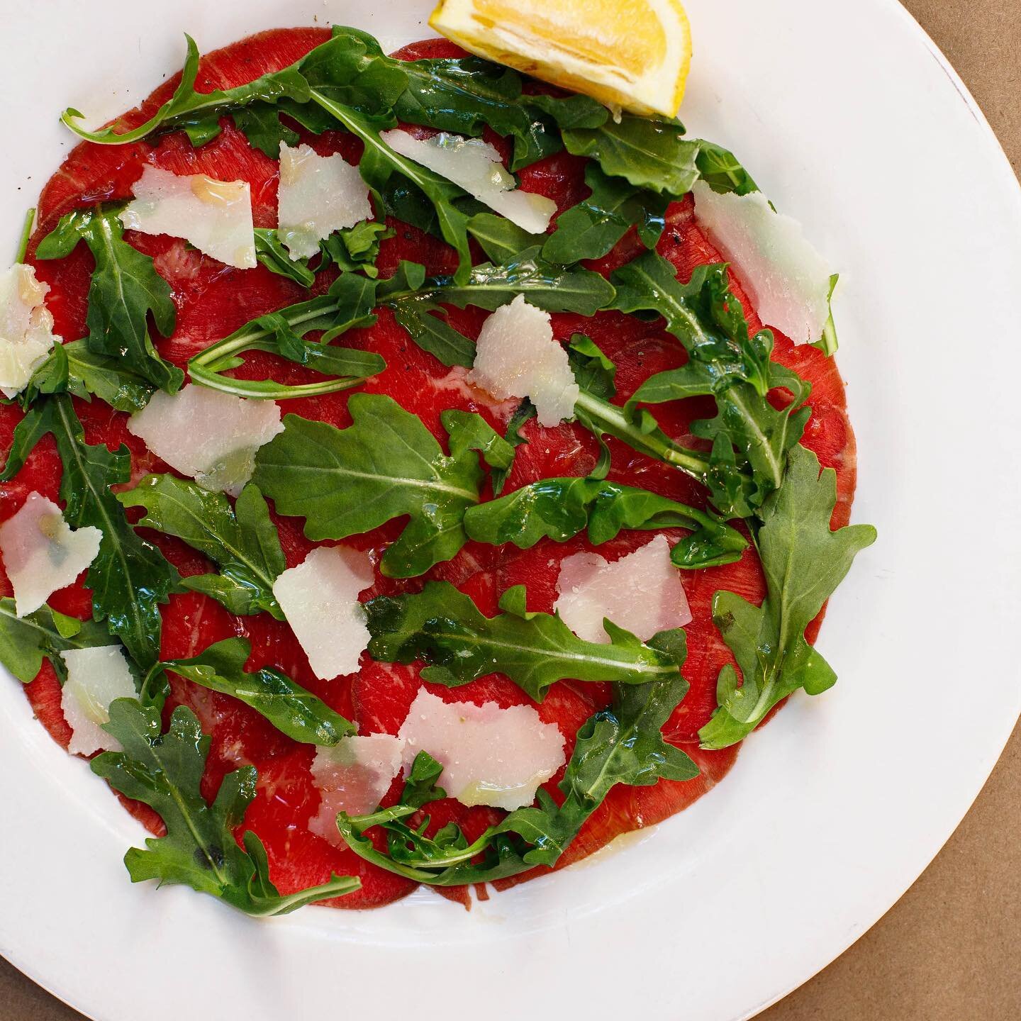 Carpaccio di manzo with parmigiano and arugula!  The perfect summer appetizer and Italian flag colors in a plate!  Find it at Fiaschetteria East!  For reservations call 212 777 3355 🍝❤️🍷 photo by @tinabfoto