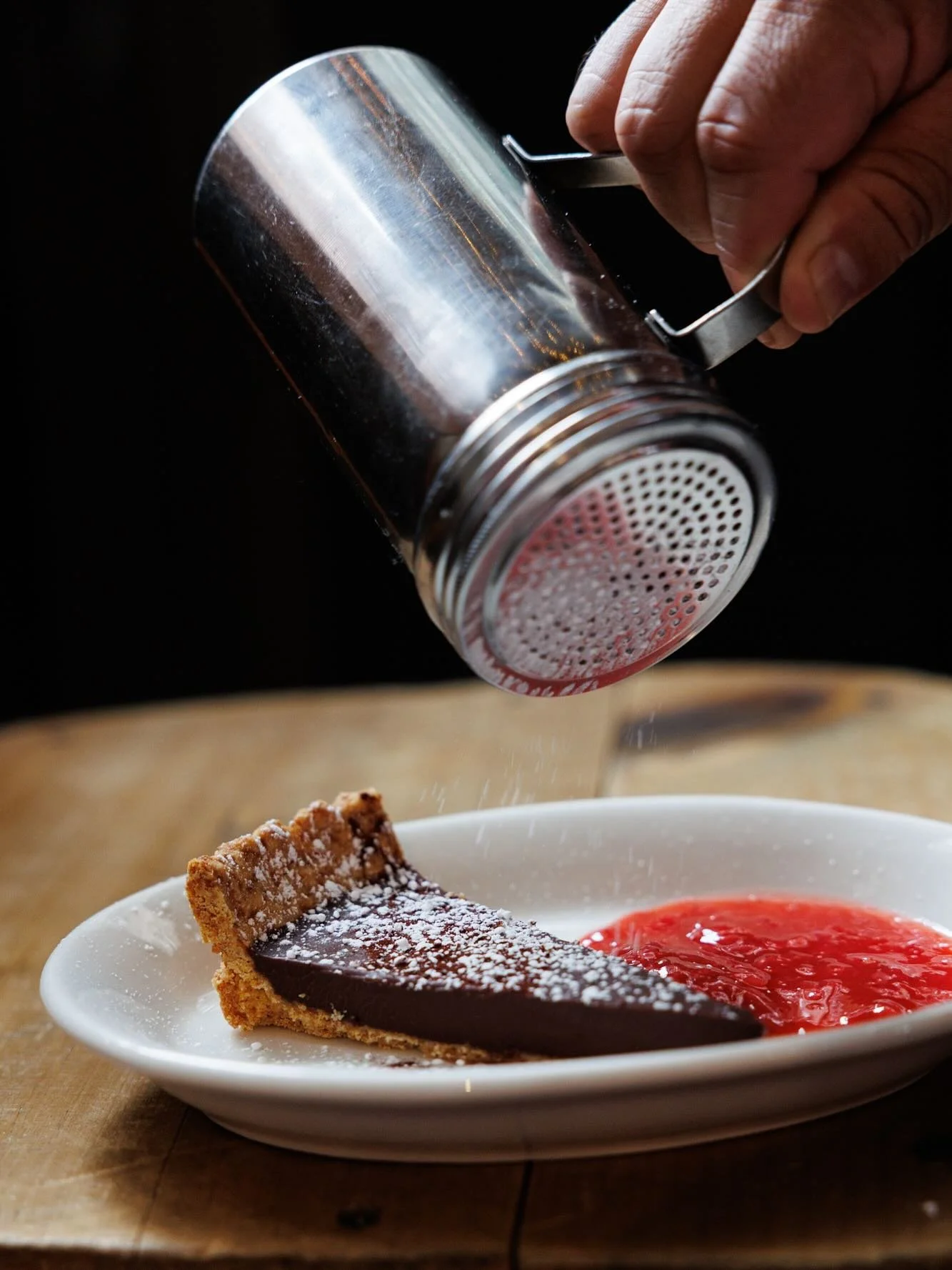 Delicious chocolate mousse on top of a delicate crostata, just dip in the strawberry sauce and enjoy responsibly!  Find it at Fiaschetteria West!  First come first serve!