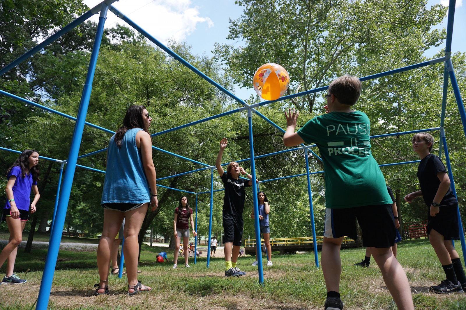  Middle School aged Summer Campers playing a game with an orange ball - NaCoMe Camp &amp; Conference Center 
