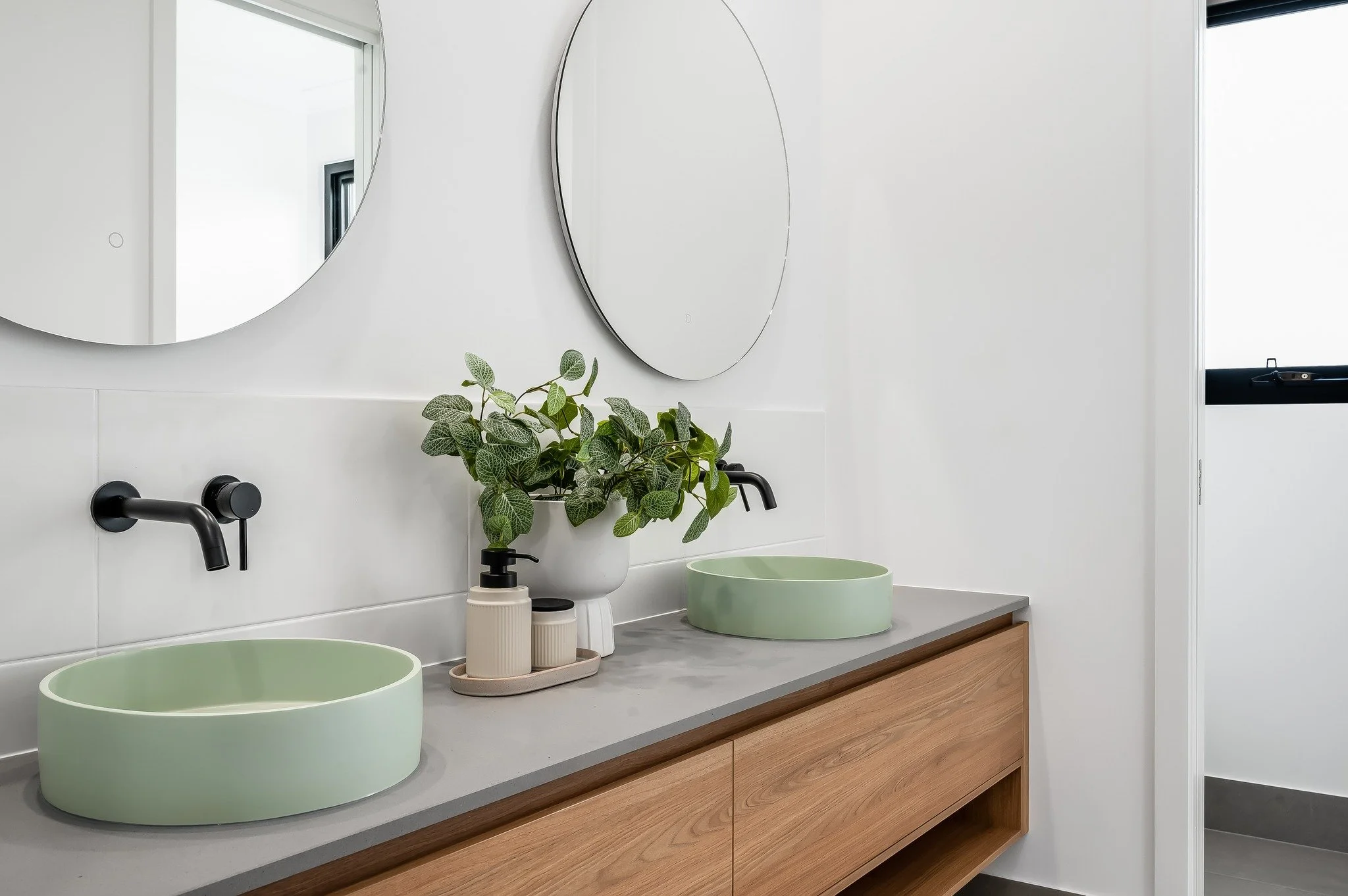 / Bathroom / 
Clean lines, calm tones, and those views.  The bathroom from our Higgins Project is simple but so effective. This award-winning home is one of our favourites - head to our website to see more!