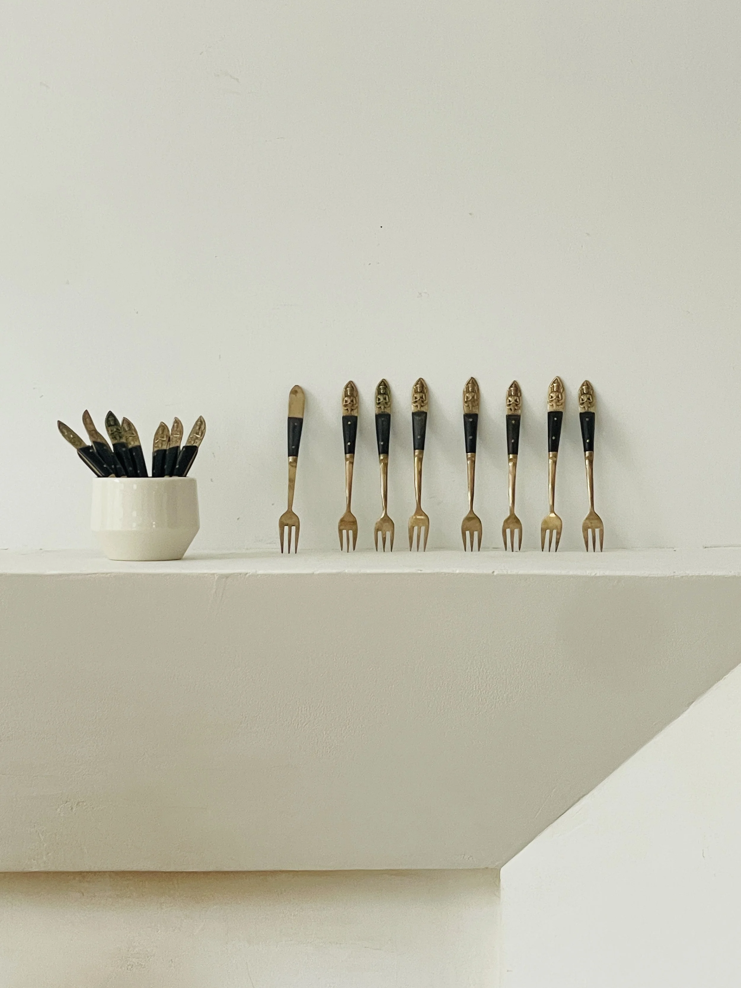 MATERI(A)NTIQUES SMALL BLACK AND BRASS APPETIZER FORKS AND SPOONS (SETS OF 8) 277-A