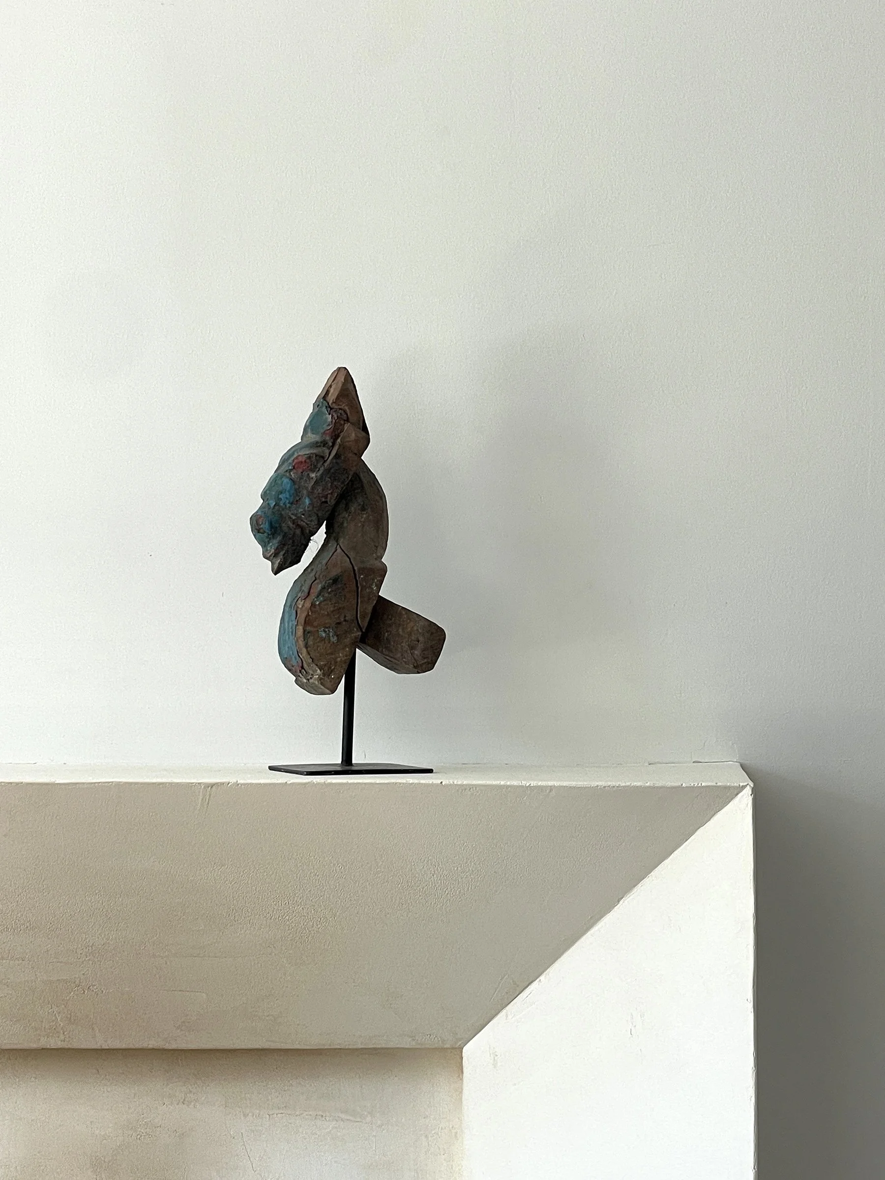 MATERI(A)NTIQUES WOODEN HORSEHEAD DECORATIVE FRAGMENT MOUNTED ON BASE; BLUE AND RED