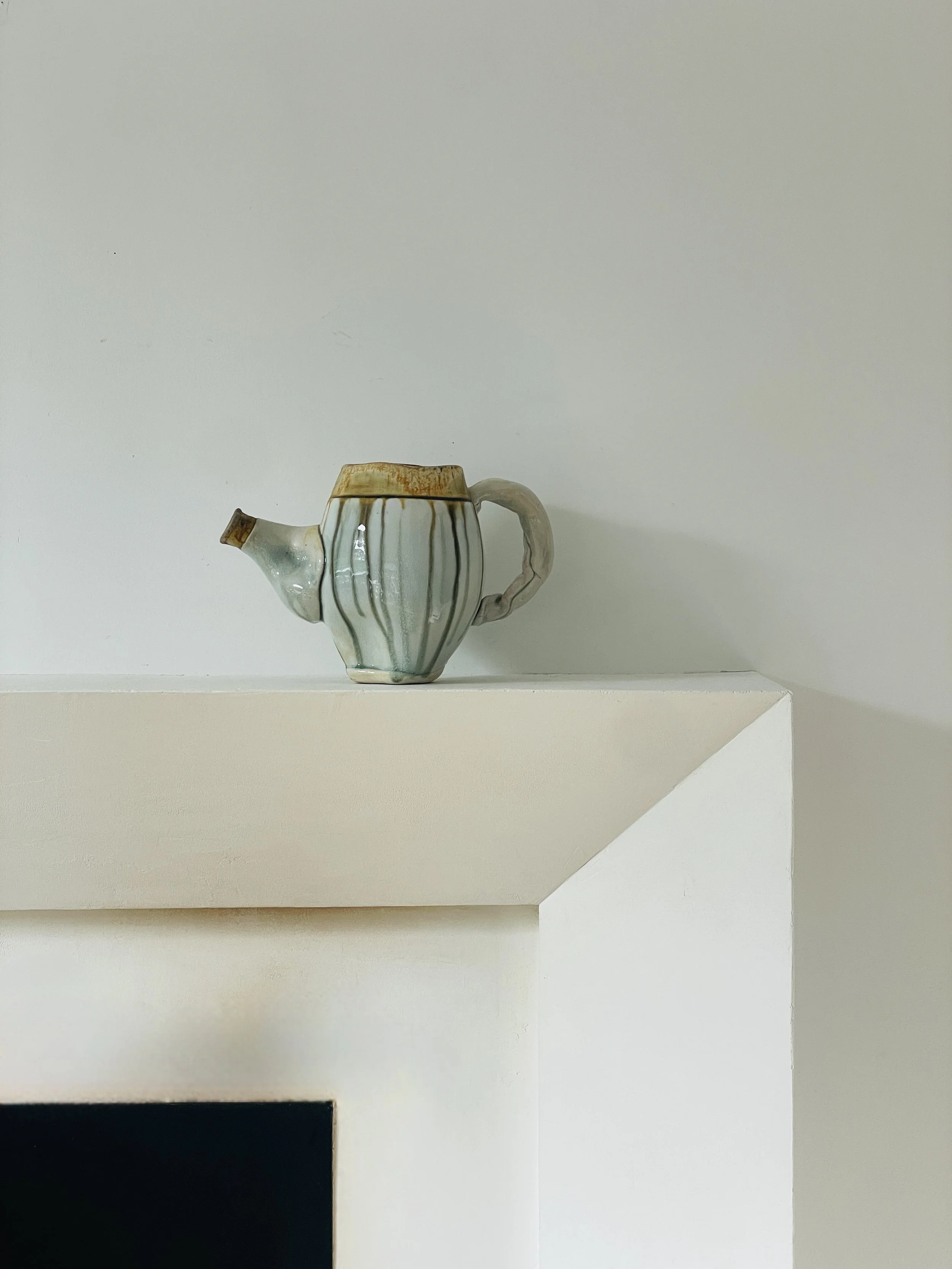 MATERI(A)NTIQUES LARGE IVORY, OCHRE AND GREEN STUDIO POTTERY PITCHER WITH IRREGULAR LIP.jpg