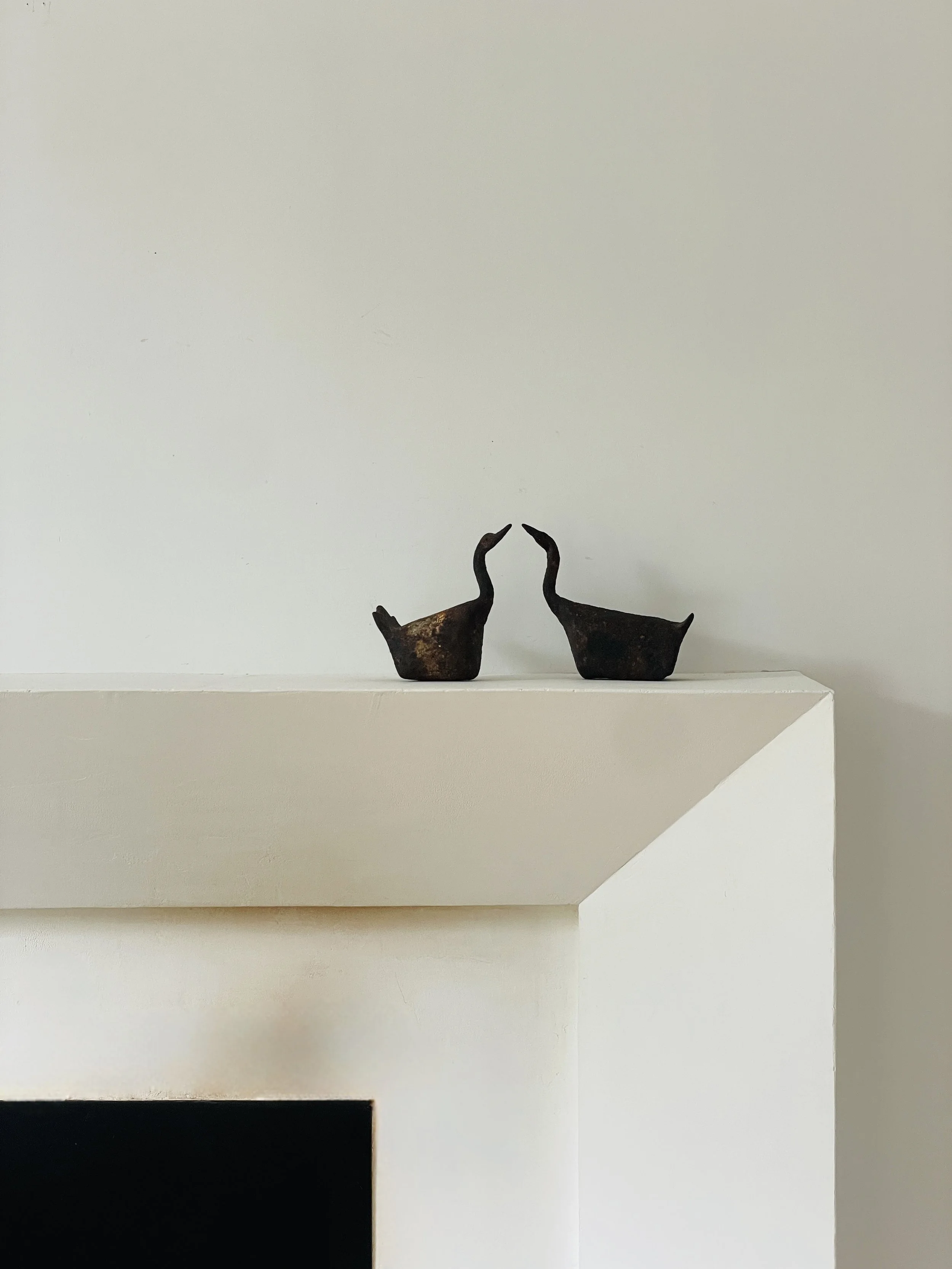 MATERI(A)NTIQUES METAL SWAN SET WITH RUST PATINA.jpg