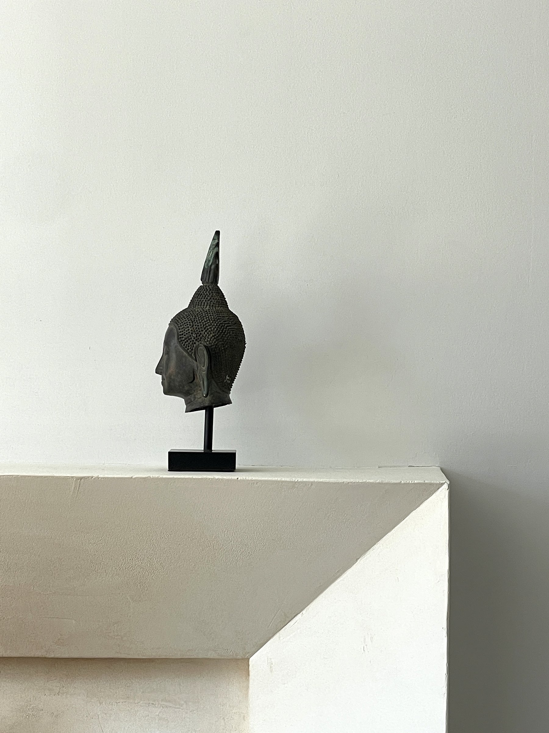 MATERI(A)NTIQUES MEDIUM BRONZE BUDHA HEAD ON STAND.jpg
