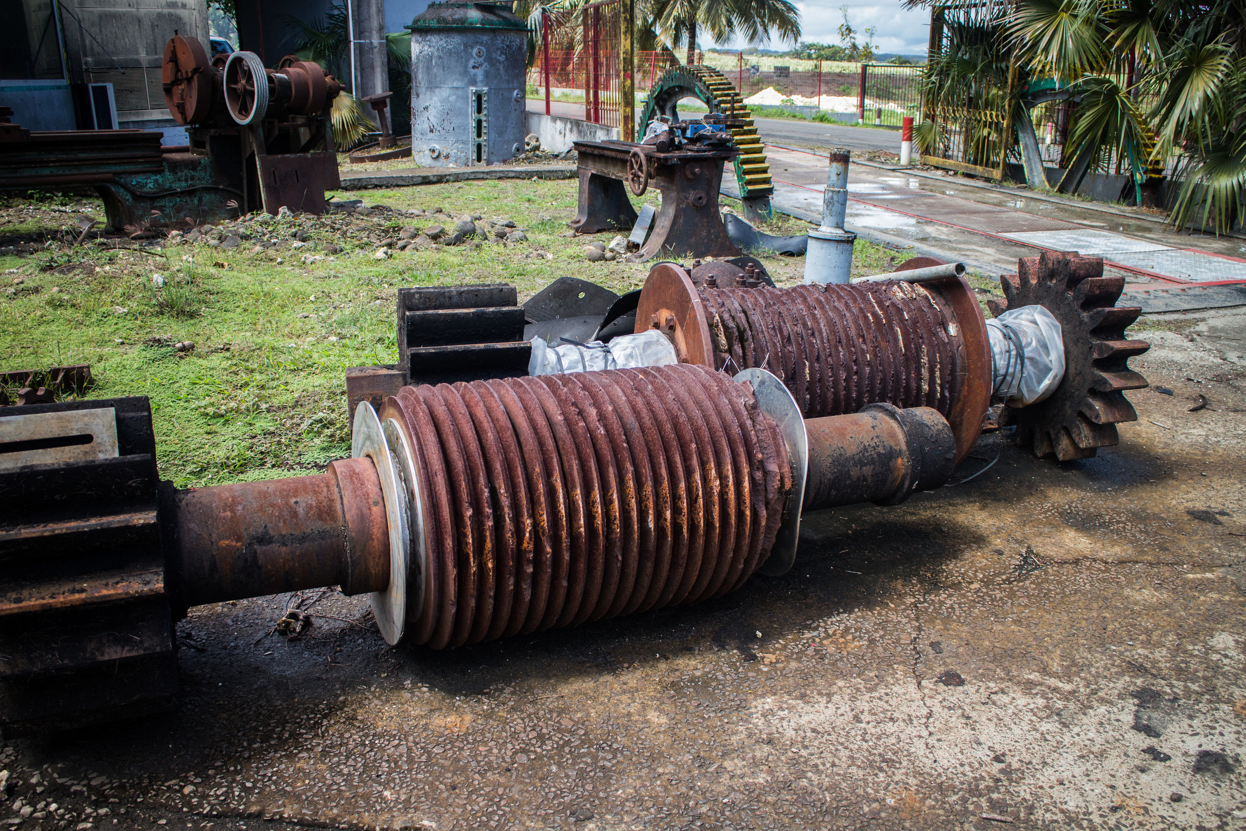 Rusted crushing wheels in the yard outside crushing area