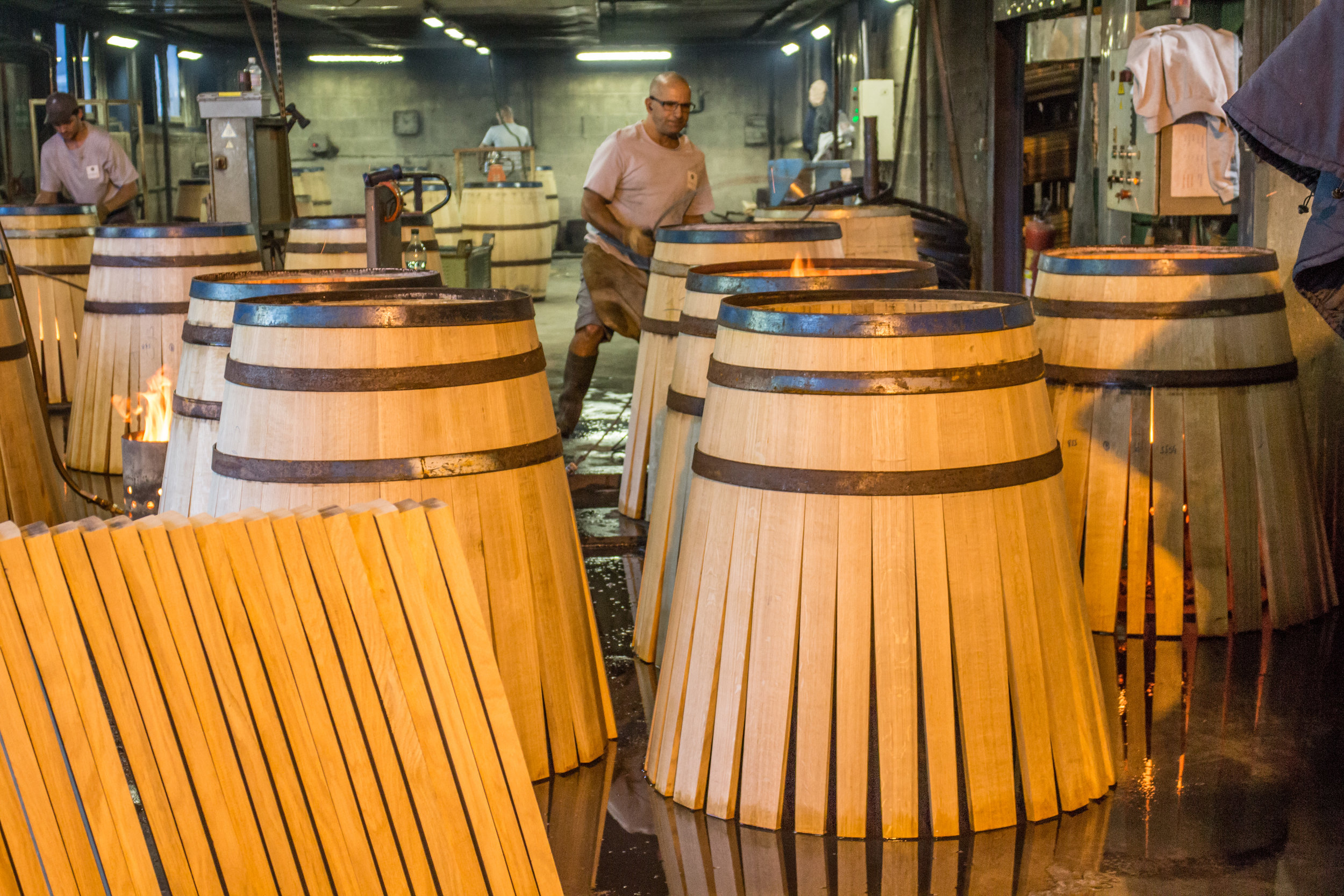 Barrels being heated and dampened in order to bend the staves, Tonnellerie Doreau (Doreau Cooperage) Cognac, France, 2015.