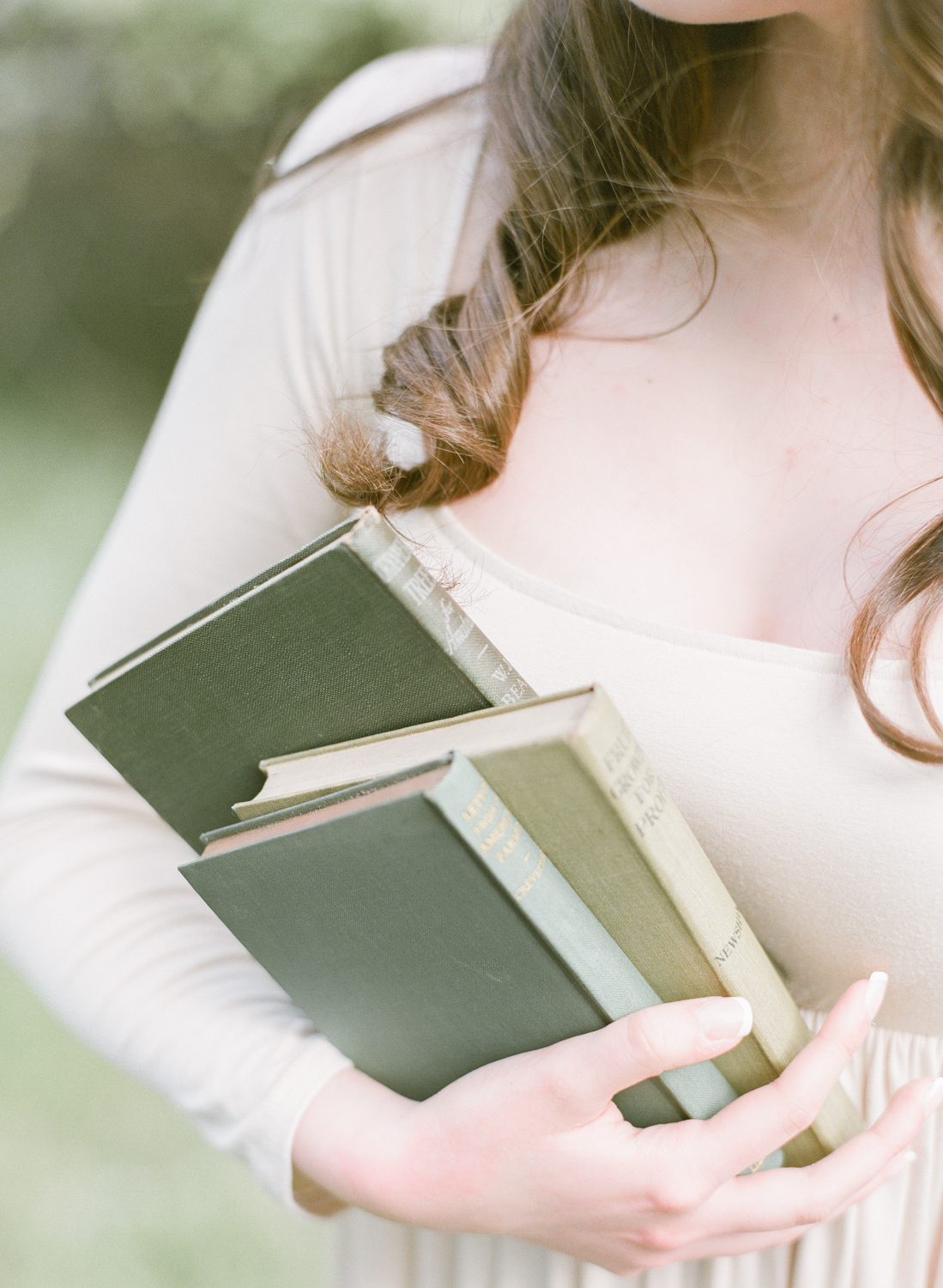 Jacqueline Anne Photography Captured on Film, A Woman in a Cream Dress, holding gardening books