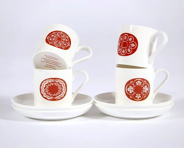 The cups are printed in the UK.  Size cup 6cm high, saucer 12cm