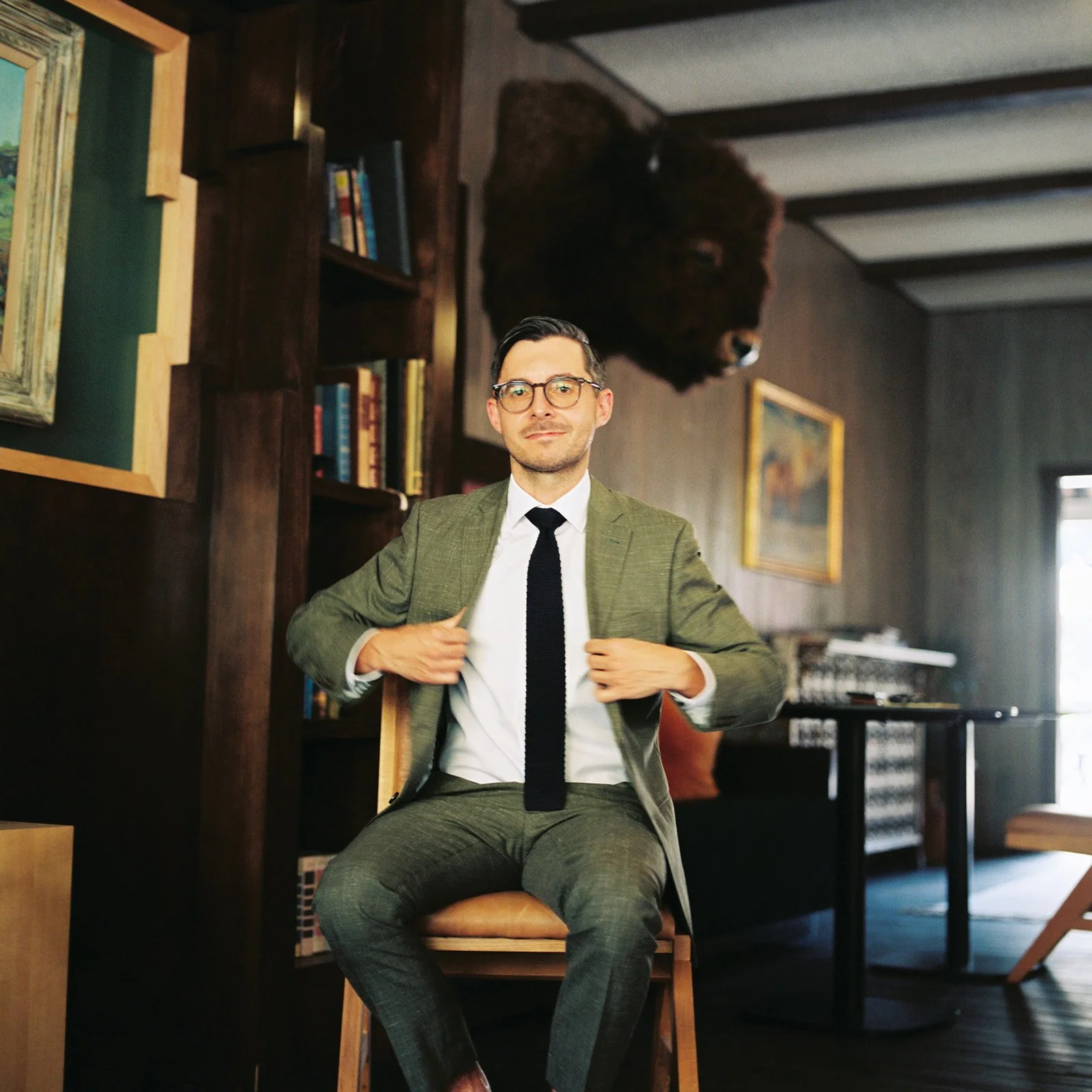 groom getting ready inside the Virginian Hotel in Jackson WY before wedding in Grand Tetons National Park