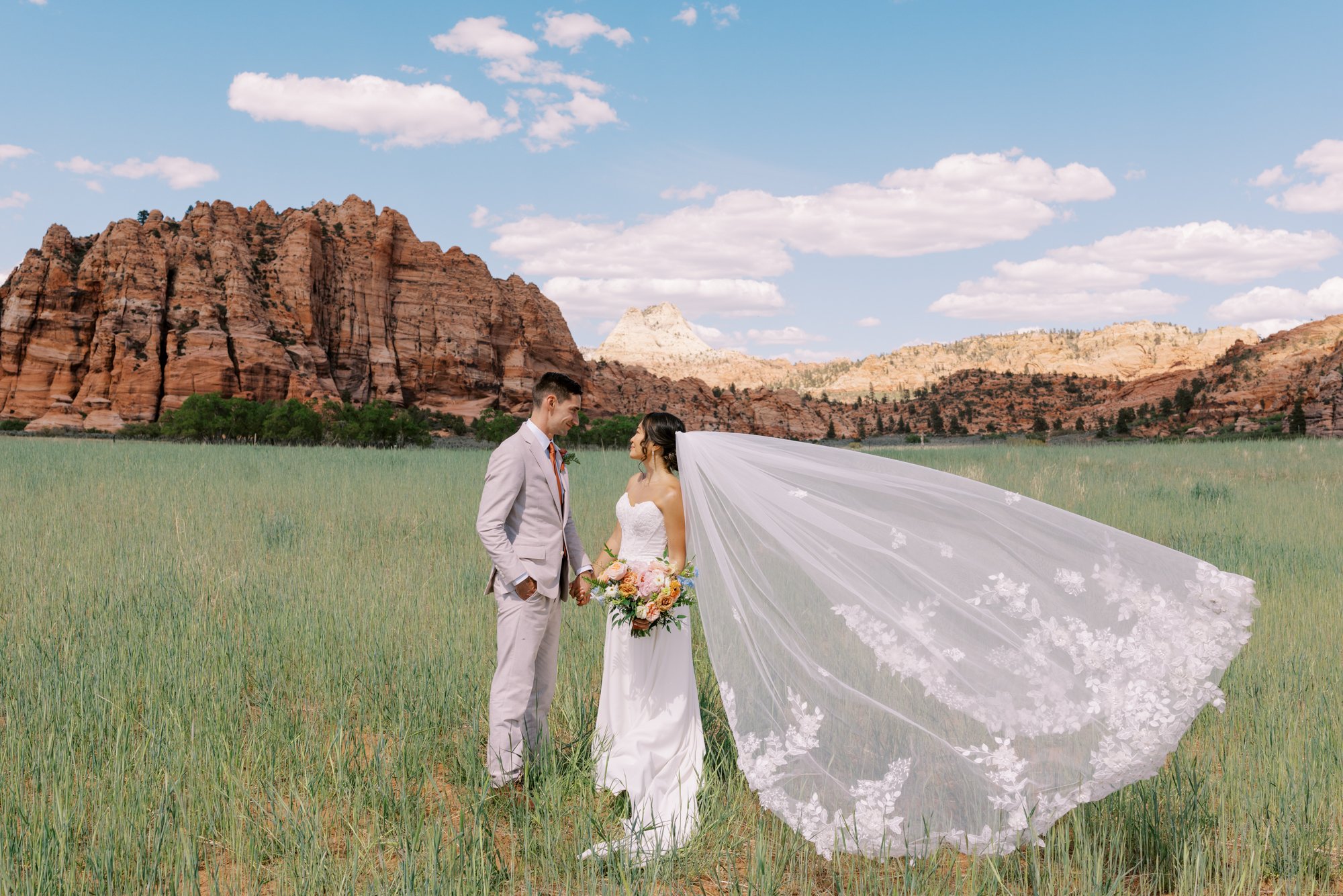 Zion wedding photography, zion national park wedding photographer, AutoCamp Zion Utah wedding, bride and groom in a field outside of Zion National Park for their wedding at AutoCamp