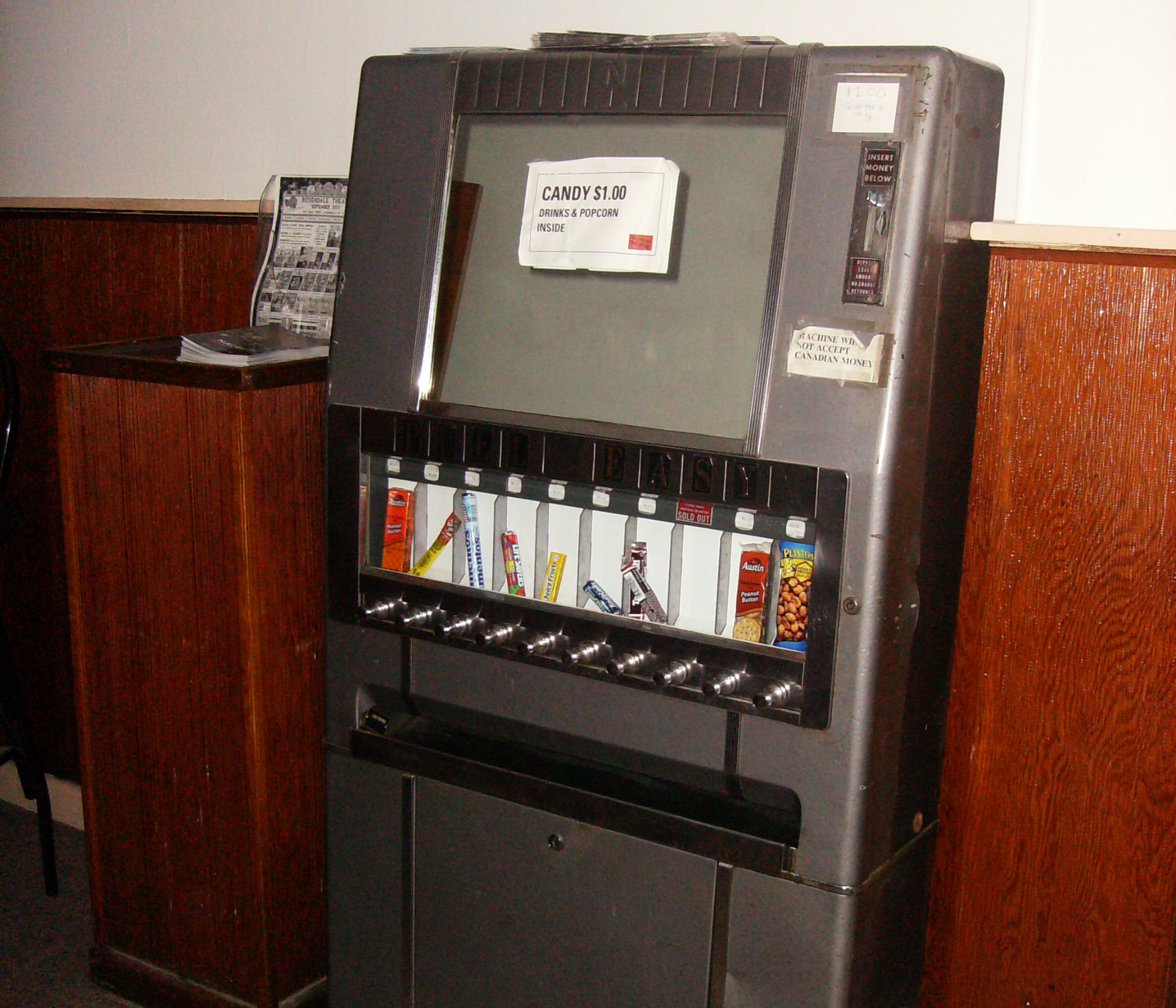 An old vending machine that dispenses candy, in the Rosendale Theatre lobby. Source: Wikicommons