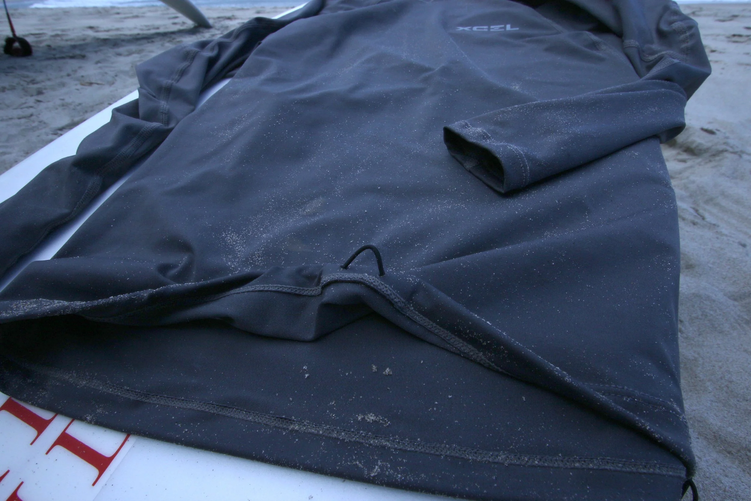 Features a loop which you can tie your boardshorts onto securing your rashie from bring ripped over your head when there’s some juice.