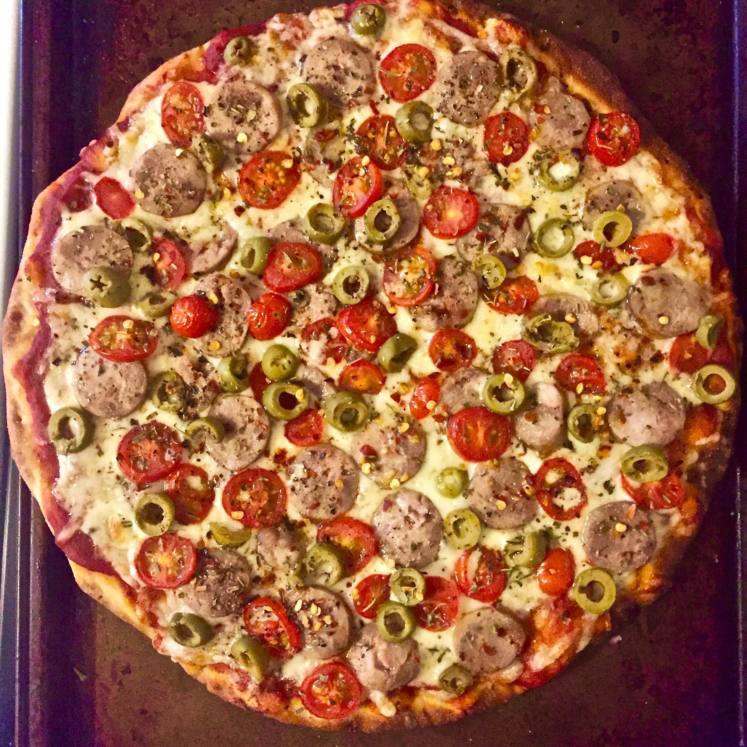 Italian sausage, green olives, grape tomatoes, and a proprietary blend of herbs and seasoning