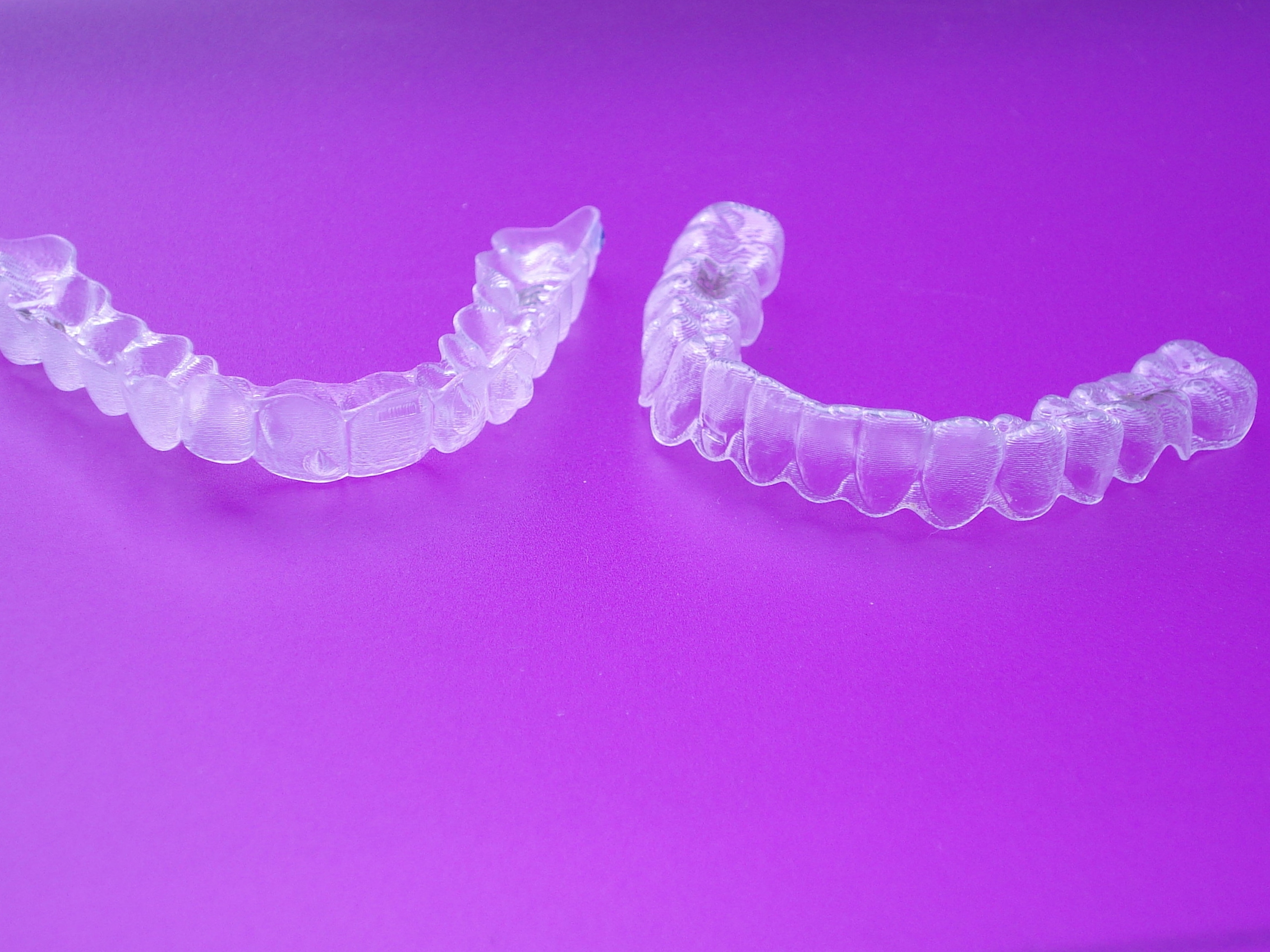 a closeup of upper and lower Invisalign aligners