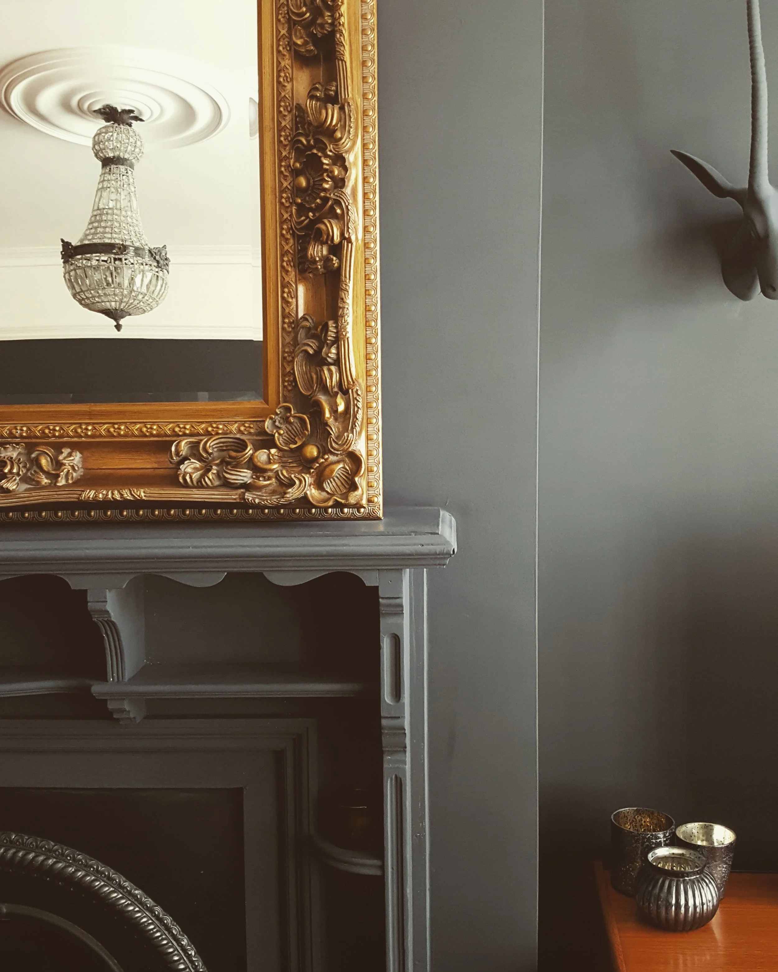 The chandelier from e-bay adds some extra drama to the room