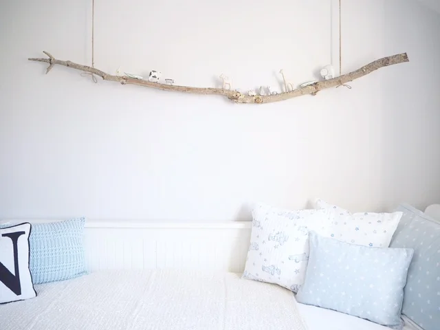 I love this idea of using a suspended branch to display Noah's zoo animals