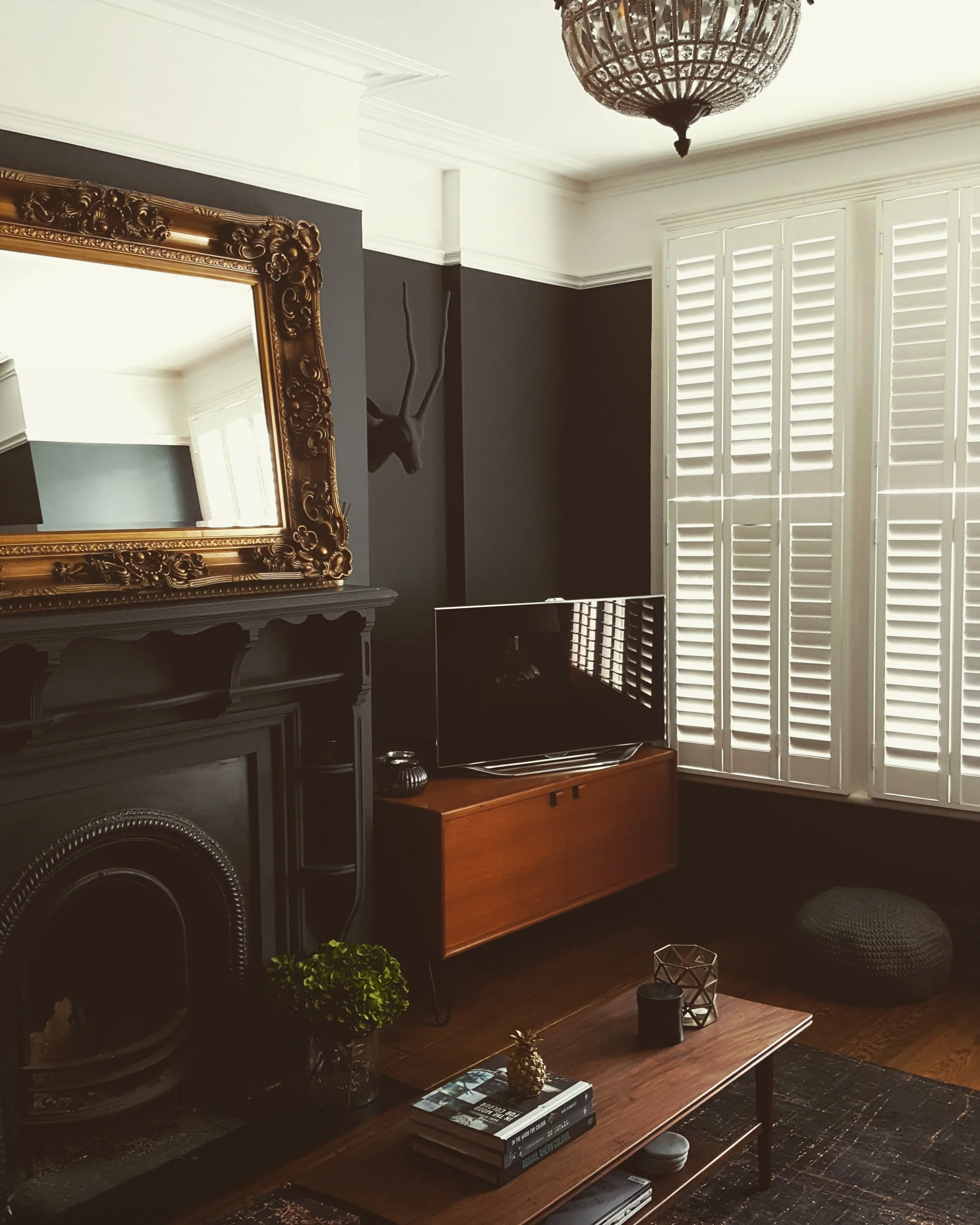 Metallics work to great effect against the dark walls. Tania got the stunning mirror from Rockett St George.