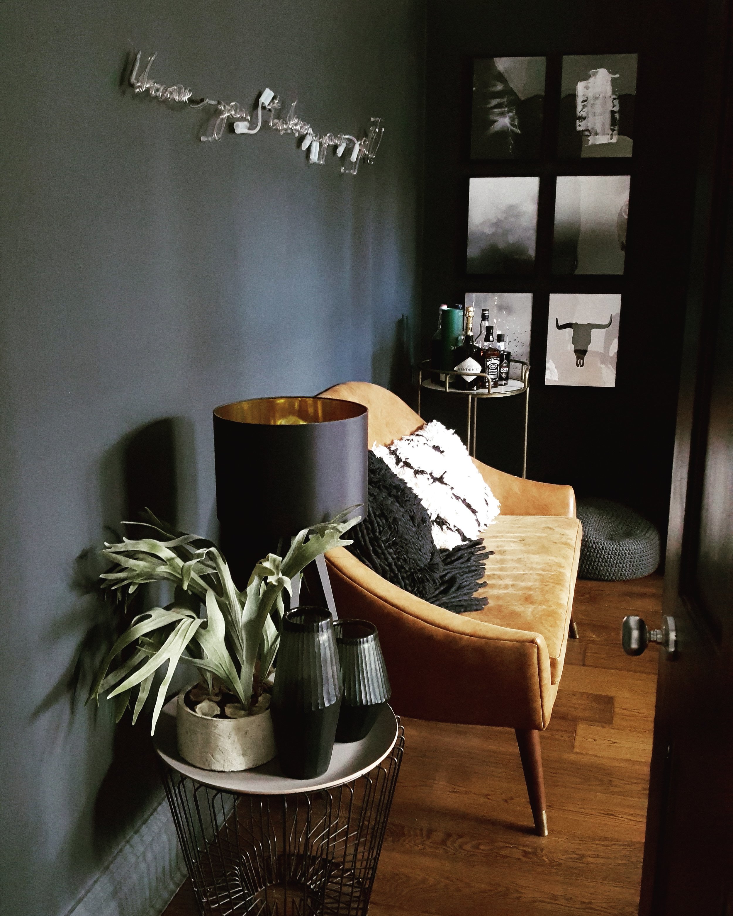Fabulous faux foliage from Abigail Ahern sitting pretty on top of a Rockett St George coffee table alongside leather sofa from and cushions from Rose & Grey
