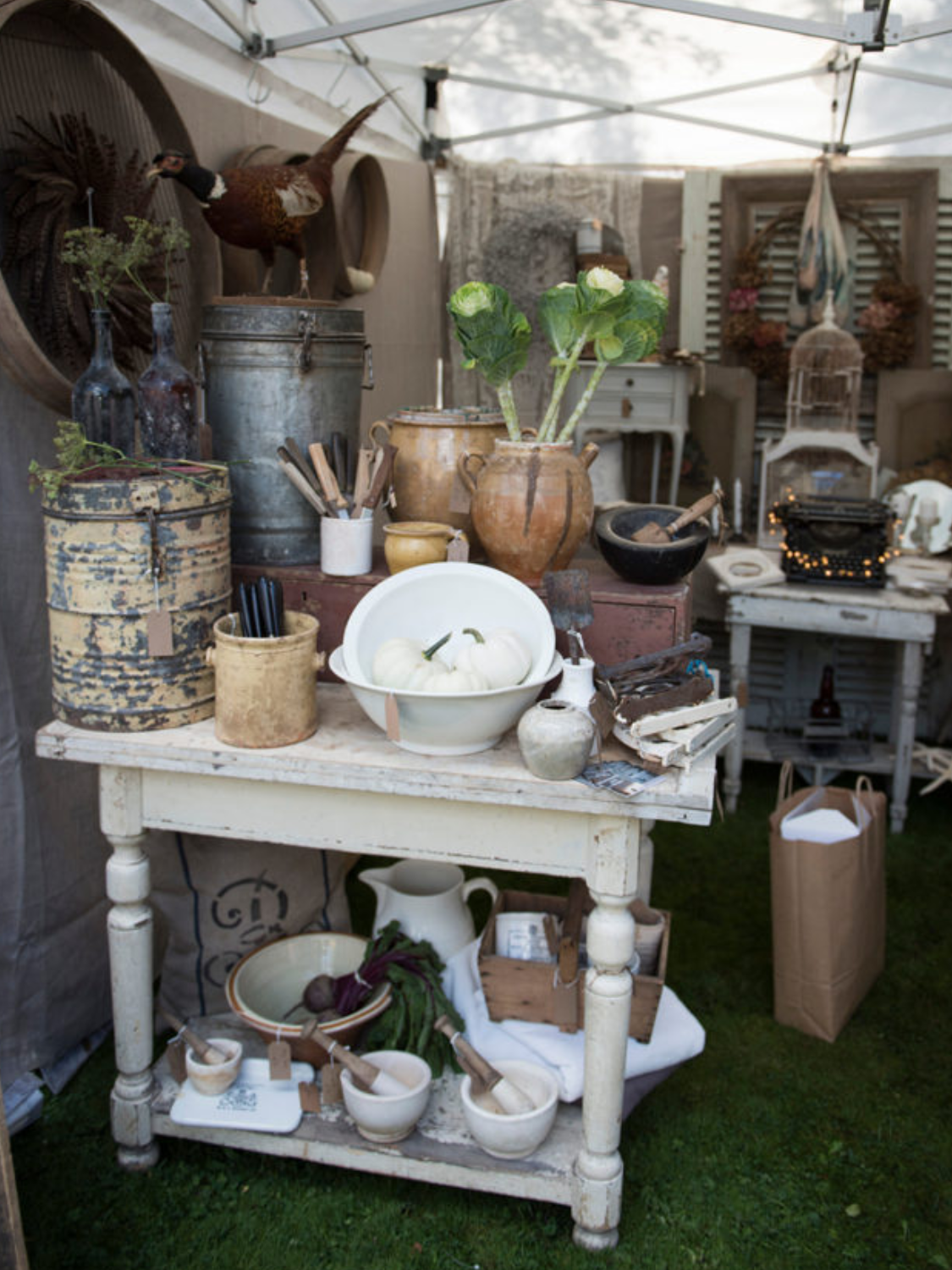 The gorgeous stall of Weathered & Worn safely under a gazebo