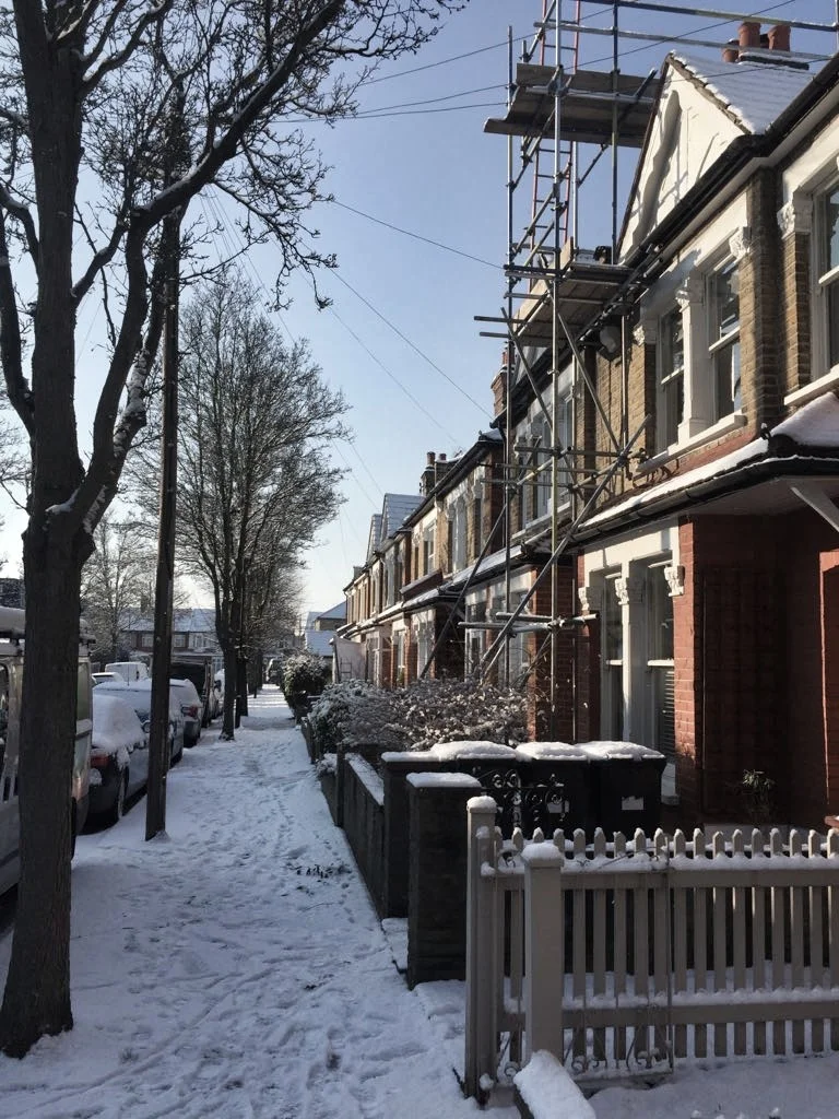 Snowy scenes in the suburbs on the day the stove went in